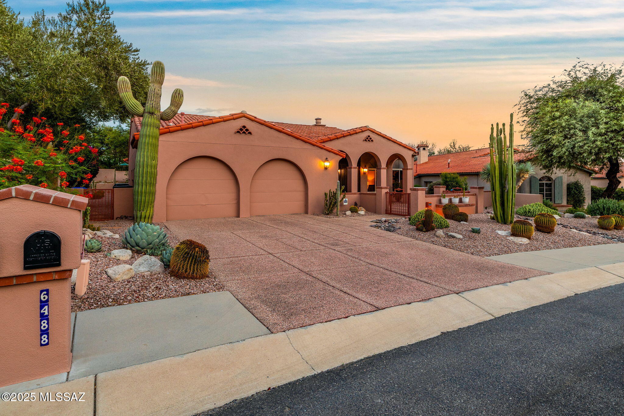 Spanish Contemporary spacious & immaculate 3 bedroom 2.5 bath home plus full den! Beautifully built Baird designed 2936 square foot home is located inside highly sought after Ventana Canyon Country Club Estates. Original owner, pride of ownership shines. Large lot is located on a two-way dead end street for total peace & quiet. Arriving at the home you'll find beautiful arched architecture with a lovely courtyard facing the mountains & plenty of build in planter beds you can enjoy both front & back yards!  Enter the home to soaring vaulted ceilings, open plan & custom lighting throughout. The large living/dining room is filled with light & perfect for any entertaining needs. Open kitchen with breakfast nook & family room boasting custom gas fireplace & beautiful built-ins.
