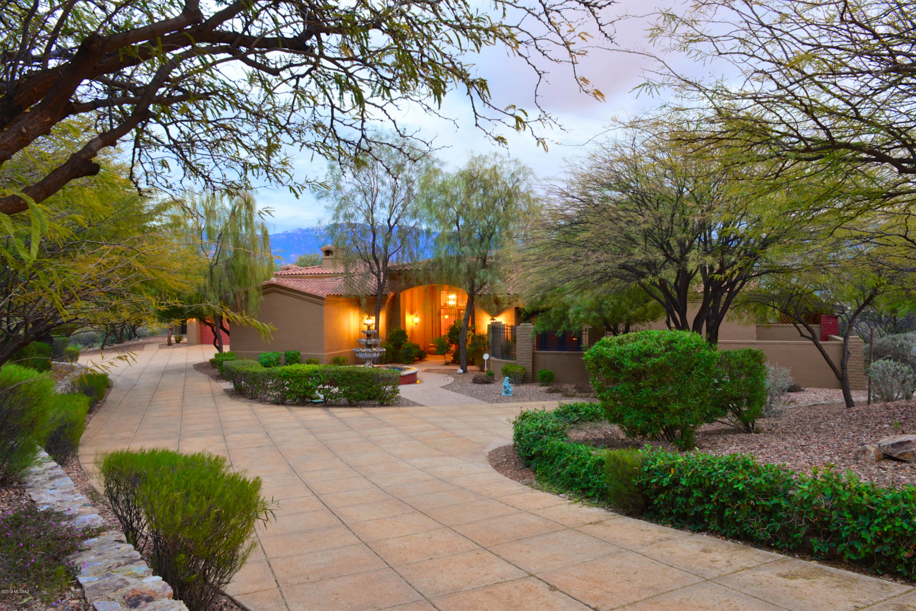 Be sure to see Virtual Tour in MLS.

Stunning Mediterranean style home located in the prestigious guard gated Honey Bee Canyon Estates. Private long drive approaching a welcoming three- tiered fountain with easy turn around.
Front entrance opening to spacious foyer and living room revealing spectacular views of the Santa Catalina Mountains.  There are views from almost every room!

This custom Masonry home with over 5800 sq ft. split floor plan, 4 bedrooms 5 baths and spacious office.  Including, an apartment size guest quarters with its own bedroom, living room, kitchenette, garage and private patio. Gourmet Granite Island kitchen with Butlers kitchen! Viking range, 2 Bosch dishwashers, Subzero refrigerators, 147 bottle wine-refrigerator, warming drawer and enormous amount of storage. Luxurious master suite, with sitting room, two-way fireplace, master bedroom, two large walk in closets and spa like master bathroom.Resort Style backyard with pool, spa water features, covered patios, built in BBQ and numerous beautiful outdoor patios. Four car garage space.

New roof replaced 3/2020

Remodeled Master Bedroom 3/2020

Repainted interior 3/2020