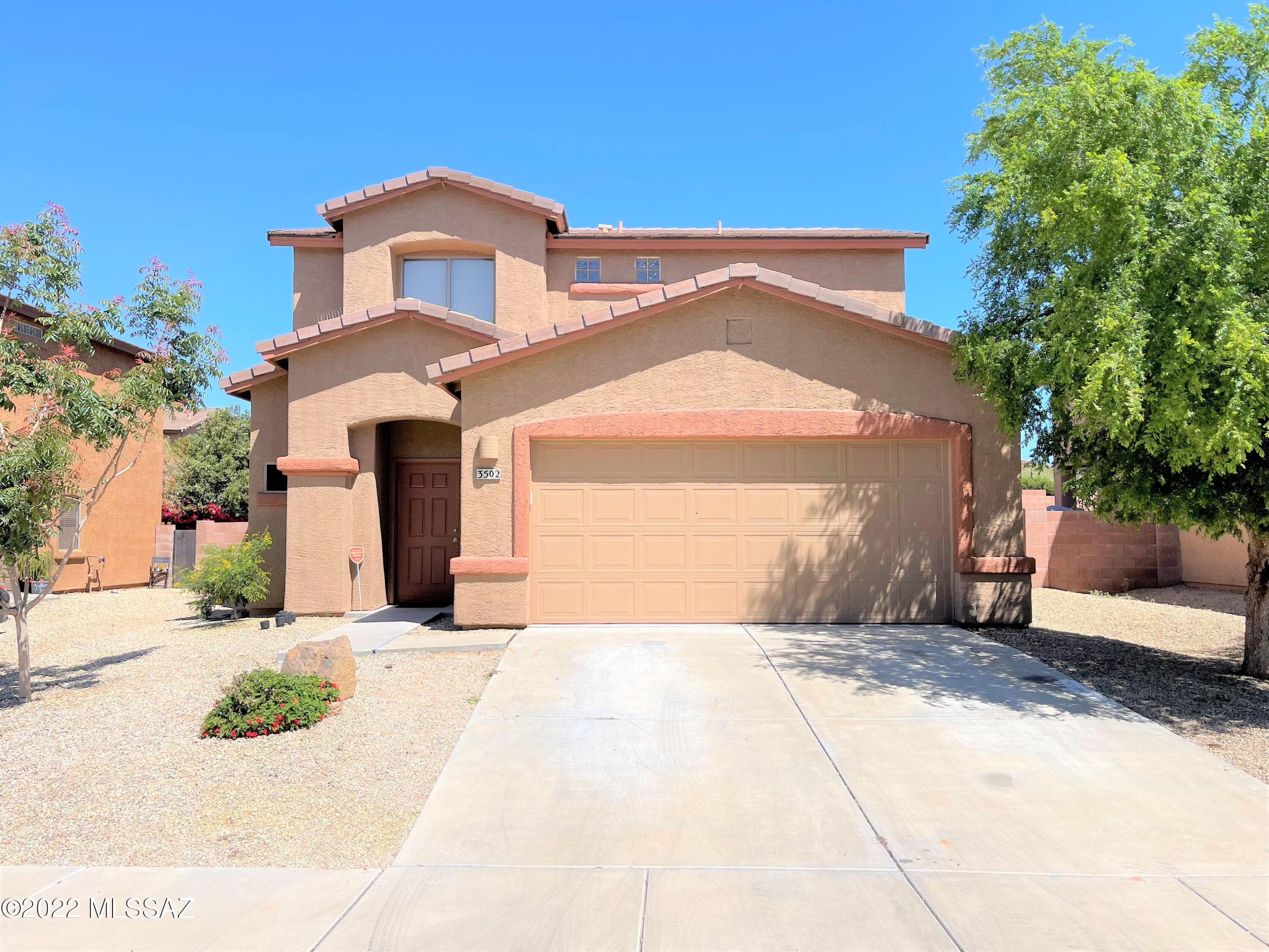 No Application Fees!  Spacious 3 bedroom, 2 bathroom Tucson home in Cortaro Crossing. This home has a number of upgrades including tile flooring throughout the first floor with upgraded carpeting upstairs, two tone neutral paint throughout, upgraded window blinds and ceiling fans in each room. All bedrooms are located on the second floor. Kitchen features Corian counter tops, extra cabinets for storage, ceramic top electric range, stove top microwave, dishwasher and refrigerator. Spacious primary suite with vaulted ceilings, walk-in closet and private bath. Easy to maintain desert landscaping in front and back.
