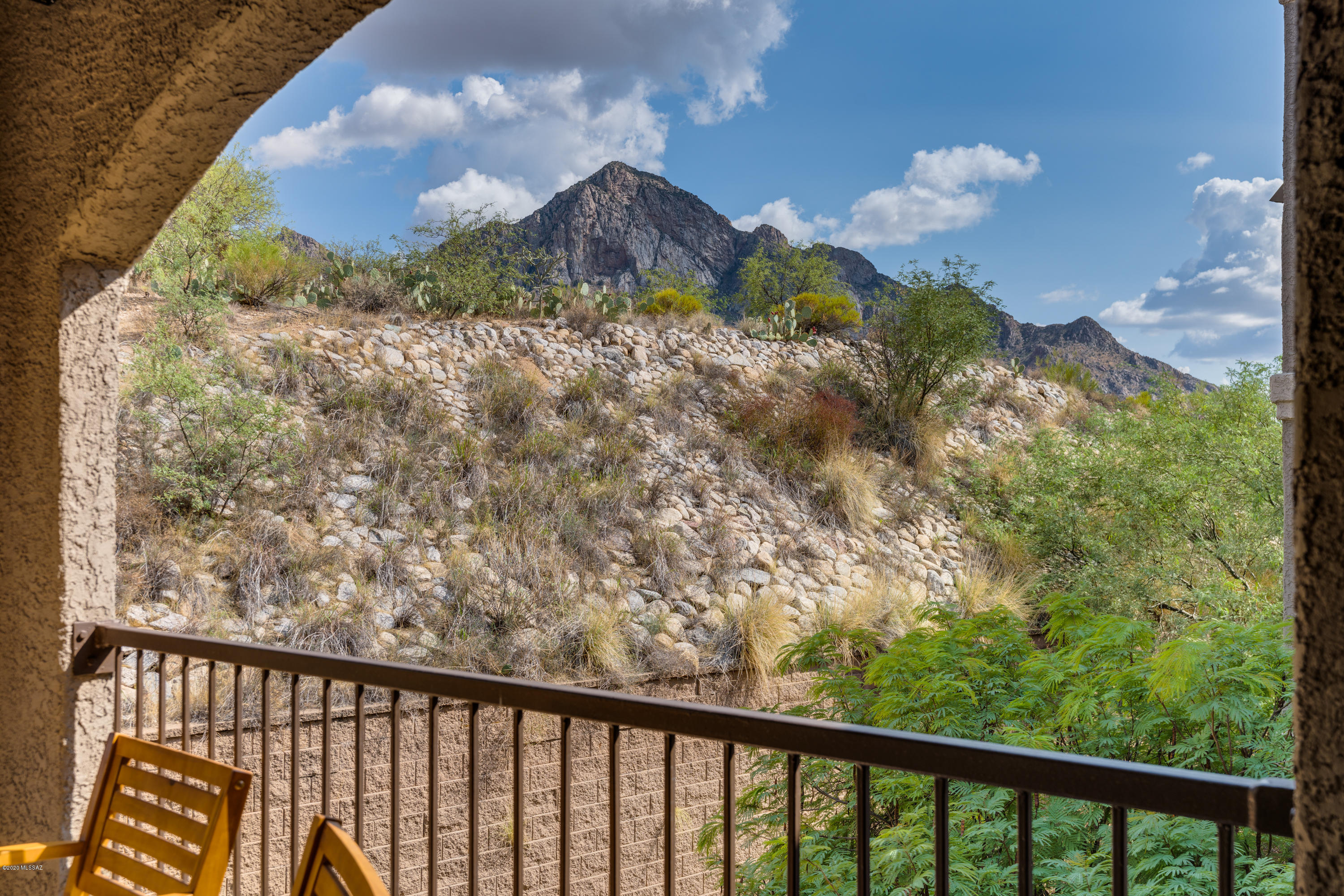 Don't miss this opportunity! Hard to obtain garage included with condo. Boulder's garages sell separately for $15,000-$20,000! You will love the terrific mountain views from the private covered wrap around balcony. This is a highly desirable 3 bed 2 bath condo in the Boulders at La Reserve. Kitchen has SS appliances, granite counters and breakfast bar that opens to great room w/wood burning fireplace. Laundry room/pantry adjacent to kitchen. Split bedroom plan, spacious walk in closets, tiled vanities in bathrooms, and combined tubs and showers. New HVAC system, hot water heater, and carpet in 2017. Condo has one covered carport. HOA includes exercise facilities, clubhouse, heated pool and spa. Nearby shopping, hiking, walking and biking trails.