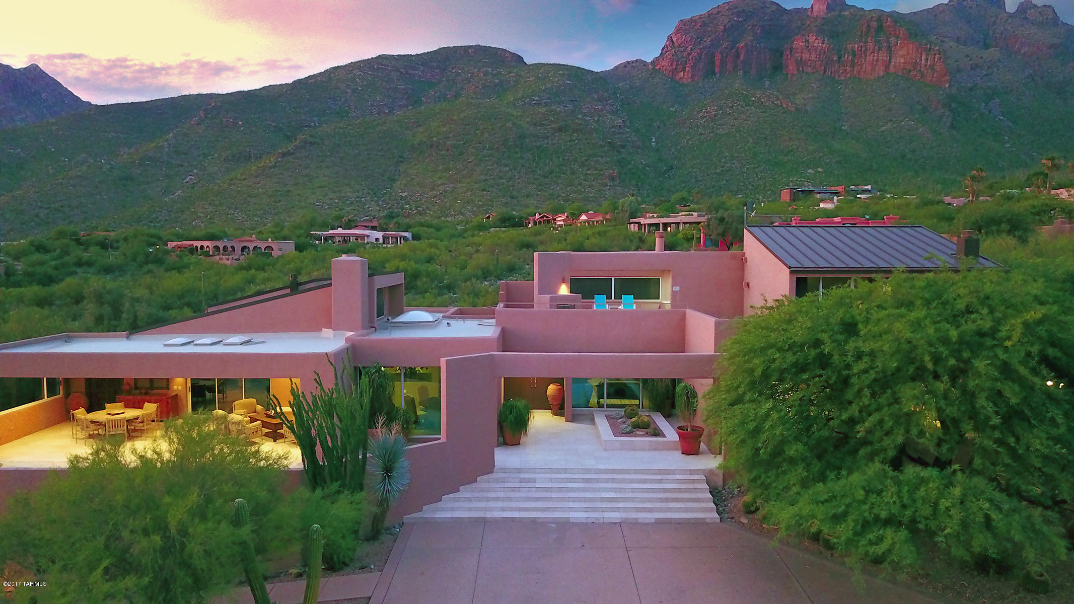 Best views Tucson has to offer! Panoramic mountain & city light views from every room in this renovated home on 4.21 acres overlooking the National Forest. Located in a prestigious Foothill's gated community, this 4 BD + office (6,099sqft) home with 5 car garage, tennis court and pool/spa is like no other. Views all the way to Pichacho Peak! Over sized commercial windows throughout this home maximizing the outstanding views! Updated kitchen with SS appliances, granite counter tops & plenty of storage. Over sized master bedroom with fireplace, patio, his/her closets and luxury bath. Outdoor living at its absolute finest. Over sized covered/uncovered patios, outdoor fireplaces, pool/spa, outdoor kitchen, outstanding landscaping. Home must be seen to appreciate. Views, views, views!
