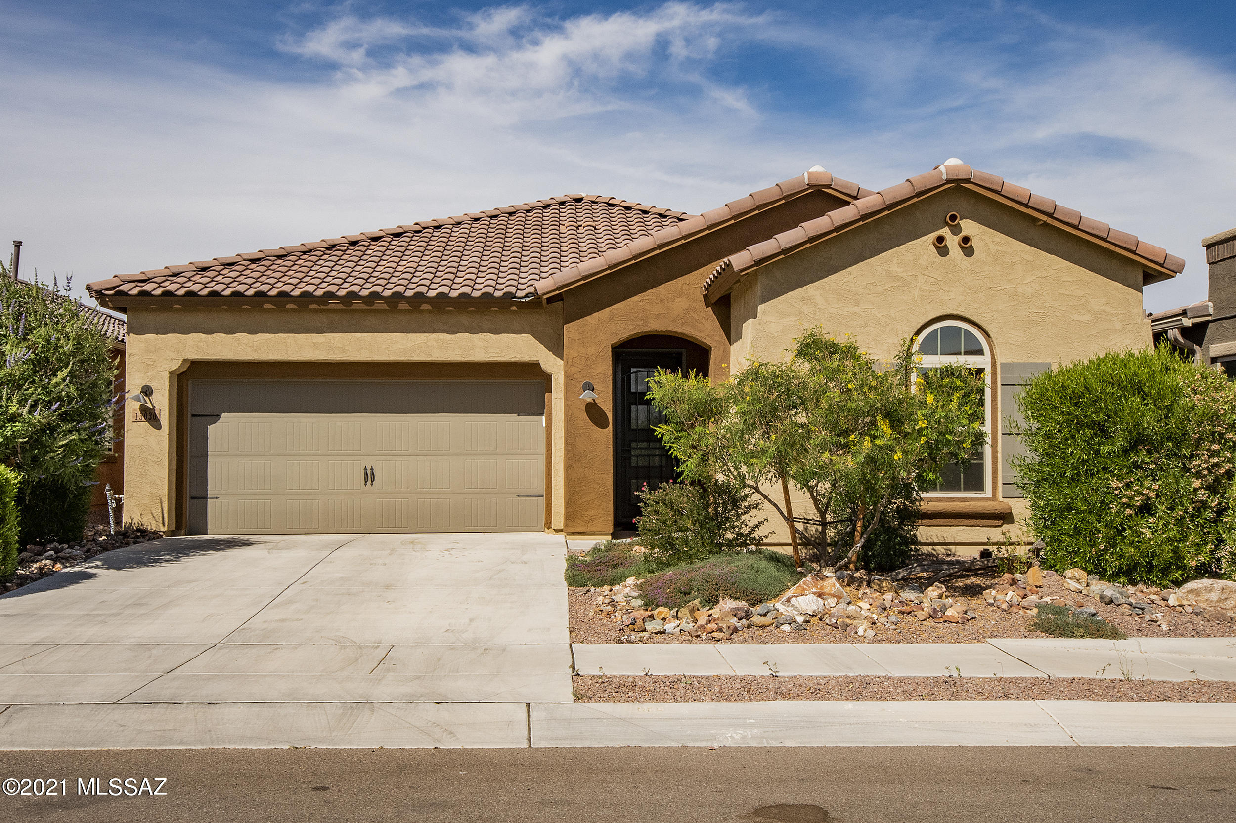 Wonderful Mattamy home that backs to open space with amazing views to the Catalinas! Built in 2018, this is a 1796 s/f, 2 bedroom PLUS den, open floor plan, split bedroom design.  Large island in the kitchen with plenty of cabinetry and counter space, breakfast bar and dining area. Very functional den space with built desk and Murphy bed if you need extra space for guests.  Large owner's suite with access to backyard, large bath with soaking tub and separate shower, dual vanities and large walk in closet.   Enjoy those summer nights in the backyard with outdoor fireplace, open space behind, Catalina Mountain views, waterfall, artificial turf and roses!! Be sure to stop in and smell them!!