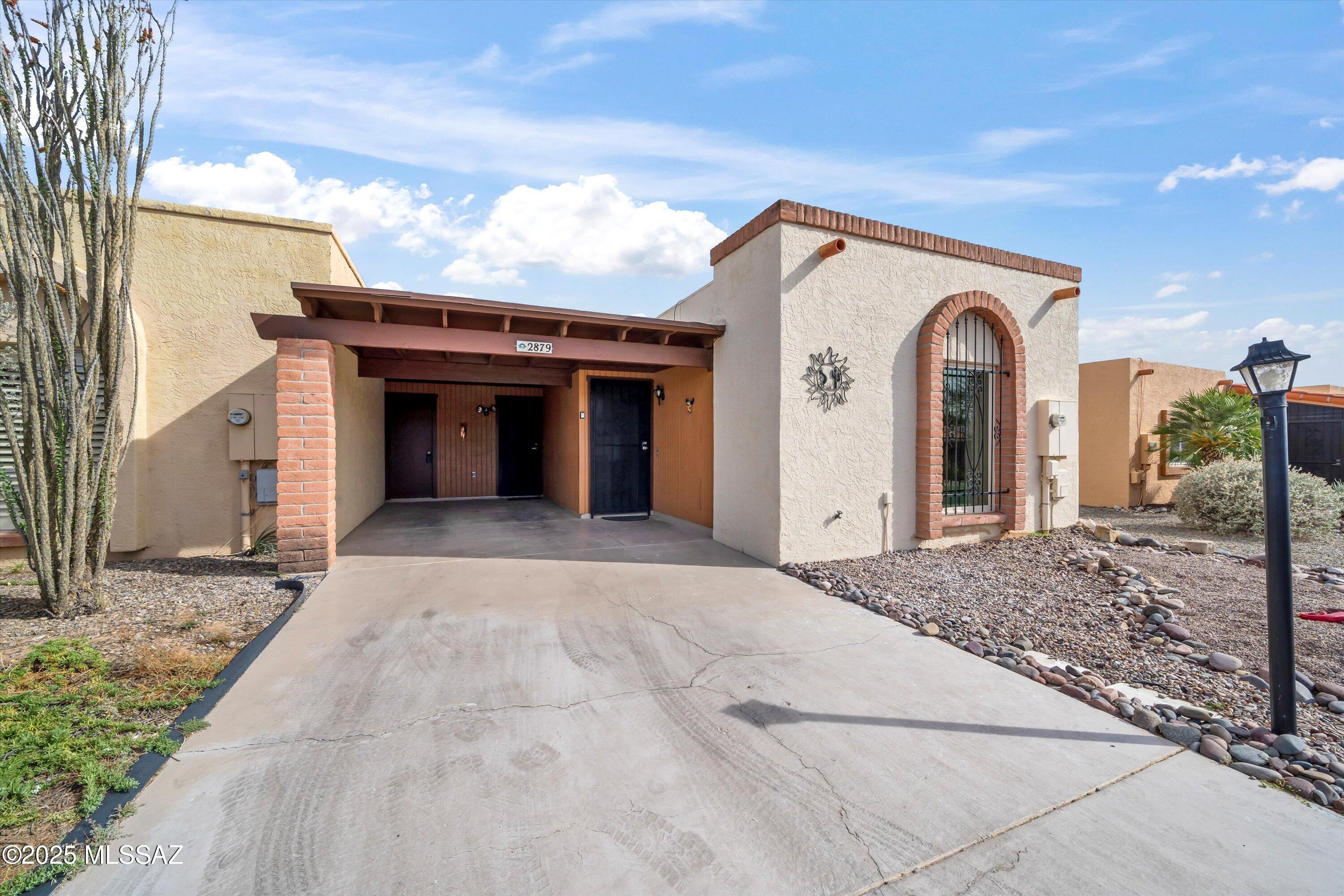 This charming townhouse, built in the 1980s, offers a cozy yet functional layout with large windows that frame stunning views of the surrounding Mountains. The home features classic design elements of the era, with  open living spaces. Its elevated position provides plenty of natural light and sweeping vistas, making it a perfect retreat for those seeking a peaceful, scenic setting. Well maintained by the current sellers and ready for the new owners. Place is fully furnished with all needed items including kitchen items. Washer/dryer and refrigerator included... Brand New mattresses and new linens in both bedrooms. Just bring your clothes and your toothbrush on this one....