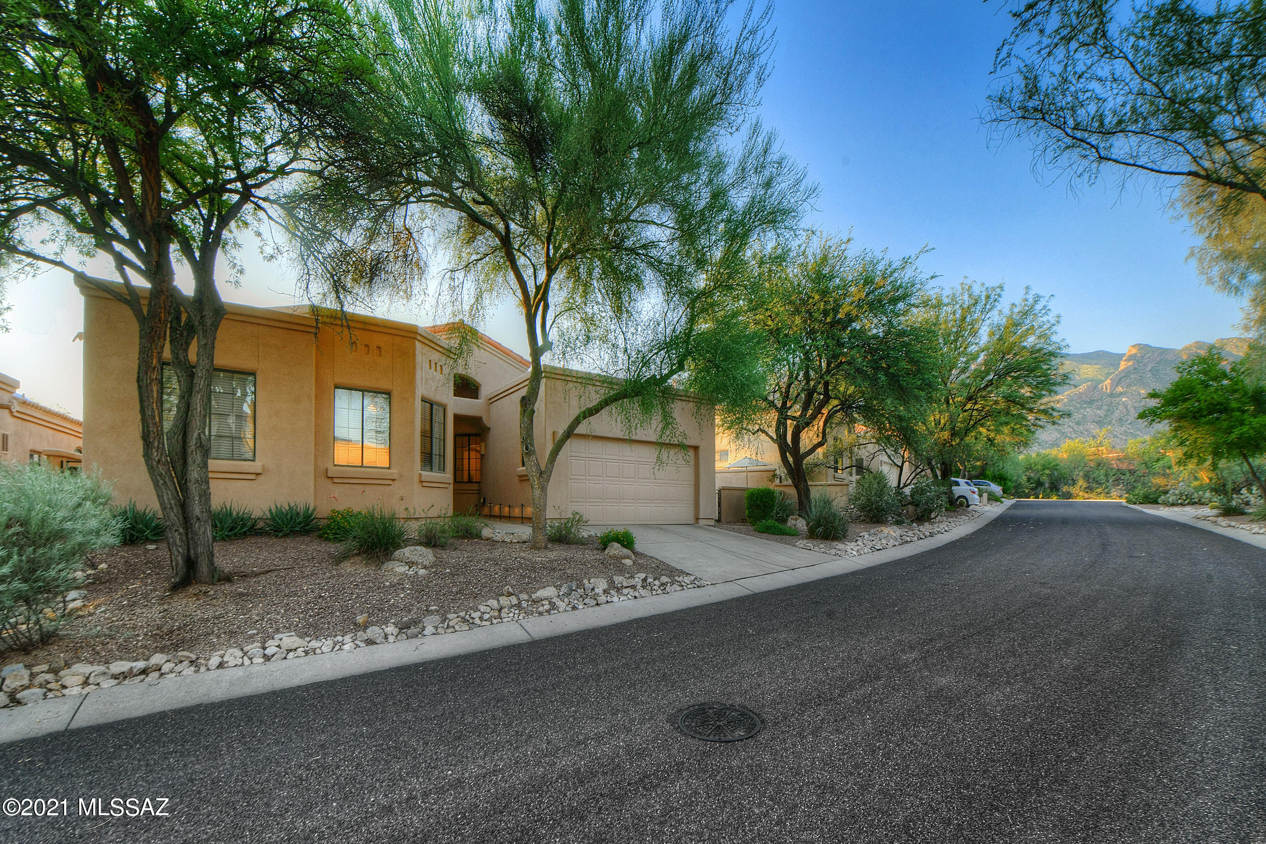 Single level, upgraded home in the prestigious gated community of Encanto at La Paloma.  Over 2500 sq ft, 4 bedrooms, 2.5 baths and an extra bonus room for TV area or additional office space.  Spectacular views of the Catalinas from back of yard - truly breathtaking. Extremely upgraded with wood like tile plank floors through all rooms except 3 of the bedrooms that has new carpet - new baseboards throughout.  Quartz countertops in kitchen & laundry with backsplash, new stove/dishwasher/AC. Half bathroom entirely remodeled.  Exterior of home recently painted, pavers installed in backyard, walkway with lighting, new turf on side of home.  This home is turnkey ready - would be great for primary residence or a 2nd home. Located in an award winning school district / close to shopping and dining Buyers can join the Westin Paloma Country Club for amenities and club benefits for an extra fee which is within walking distance.
