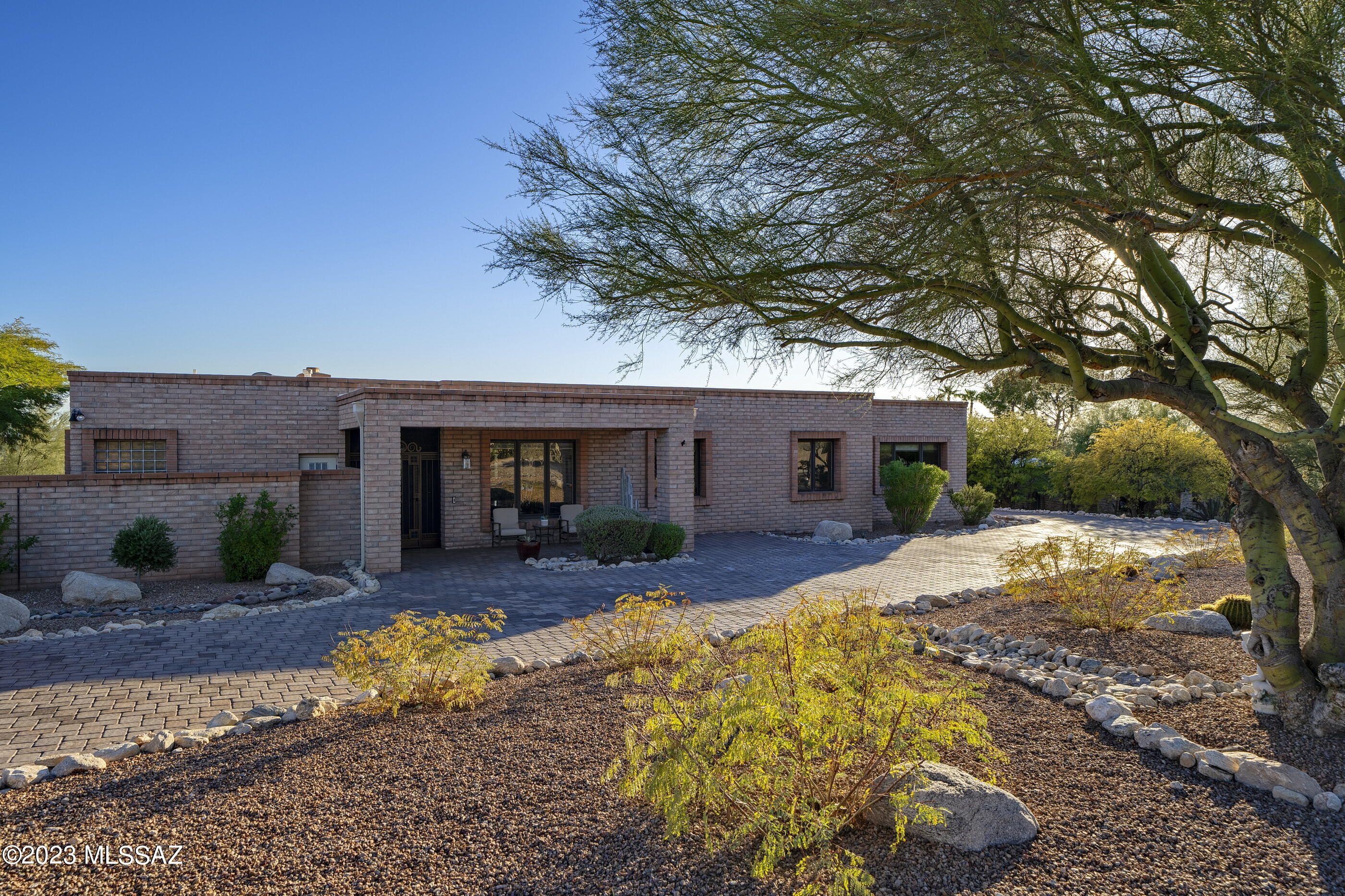 Dream Home with Privacy & Views! Tastefully Remodeled in a Contemporary Aesthetic that complements the Traditional Elements and Timeless Appeal of a Custom Masonry Home. Featuring 4BR/2.5BA, the Bright, Open Floor Plan Set for Great Entertaining and Easy Family Living includes a Gourmet Kitchen w/ workable Centerpiece Island, Seating and Extra Storage. Great Room transitions to a Large Covered Patio and meticulously maintained low care yard with Saltwater Pool & Spa. A Separate Family Room with Handsome Built-ins is both laid-back and luxurious, while Formal Living and Dining Rooms channel just the right touch of elegance. Sited on a Quiet cul de sac in a Beautiful Neighborhood of Custom Homes on Large, Gracious Lots. Close to Everything, yet away from it all!  *See List of Upgrades.