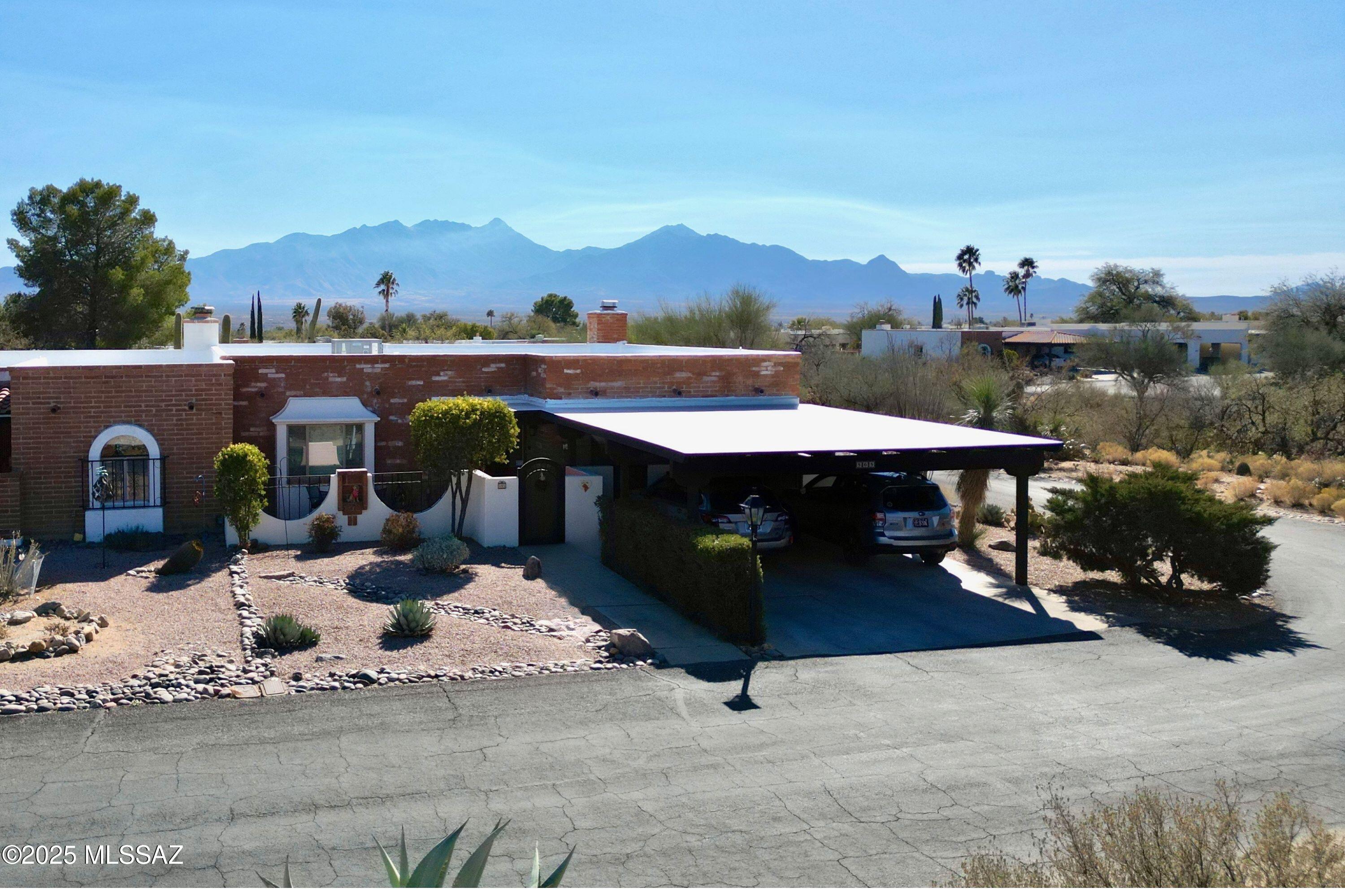 Don't miss out on this spectacular end-unit townhouse offering modern living with plenty of natural light, thanks to new and added windows throughout. The remodeled kitchen features newer appliances and an open design, while the large living space boasts beautiful overhead beams and a remote-controlled gas fireplace with custom mesquite mantel, perfect for enjoying your morning coffee. Enjoy stunning mountain views from the expansive sliding doors or from the private outdoor space. Centrally located with easy access to everything, this home also includes a new HVAC system with a transferrable warranty and recoated roof in Dec 2024. Many other updates-ask for the full list!