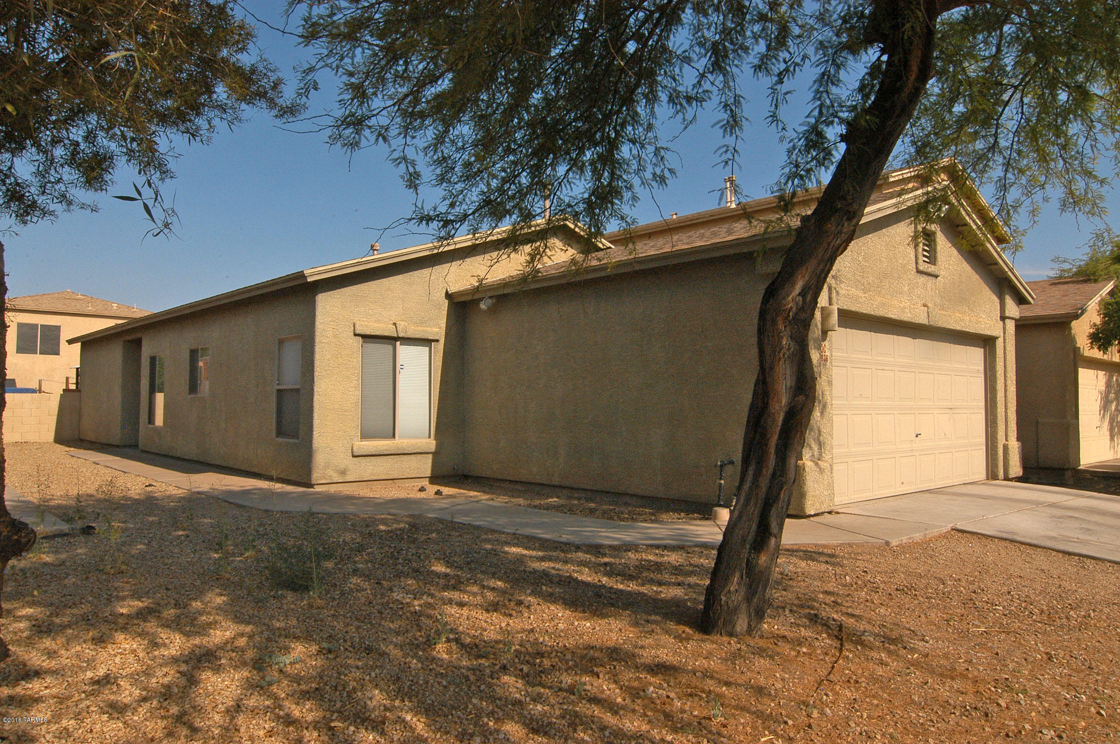Everything you need is wrapped into this charming home! Move-in ready, featuring attractive ceramic tile, ceiling fans, custom paint, stainless steel gas stove, and appealing wood-look flooring. Also SimplySafe wireless alarm, newer kitchen sink,and newer garage door opener. All appliances included, including stainless steel refrigerator. Brand new sliding glass doors lead you to a private backyard with a ramada. Welcoming neighborhood park nearby. Affordable, comfortable, convenient. A great place to call home!