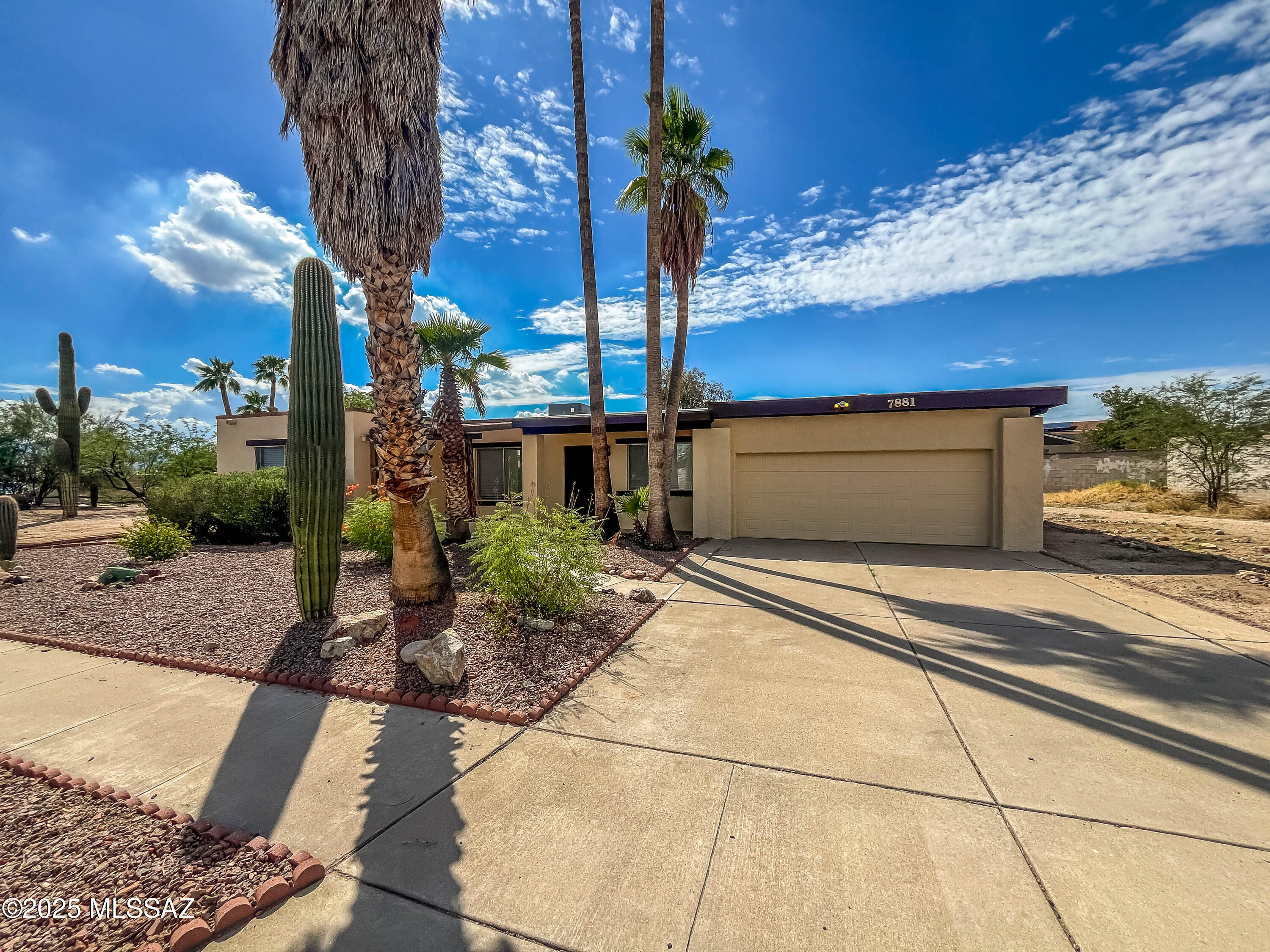 Come view this spacious 2138 sq/ft 3bd/2ba home in Orangewood Estates in NW Tucson. This home has an open floor plan with 2 separate living areas, formal dining area off the kitchen with a fireplace, 2 car garage and a workshop. Natural light shines in through several skylights.  Freshly painted interior and exterior and new carpet.  The yard is good sized with enough room to park an RV in the back yard or even room for a pool.  Corner lot and no HOA!