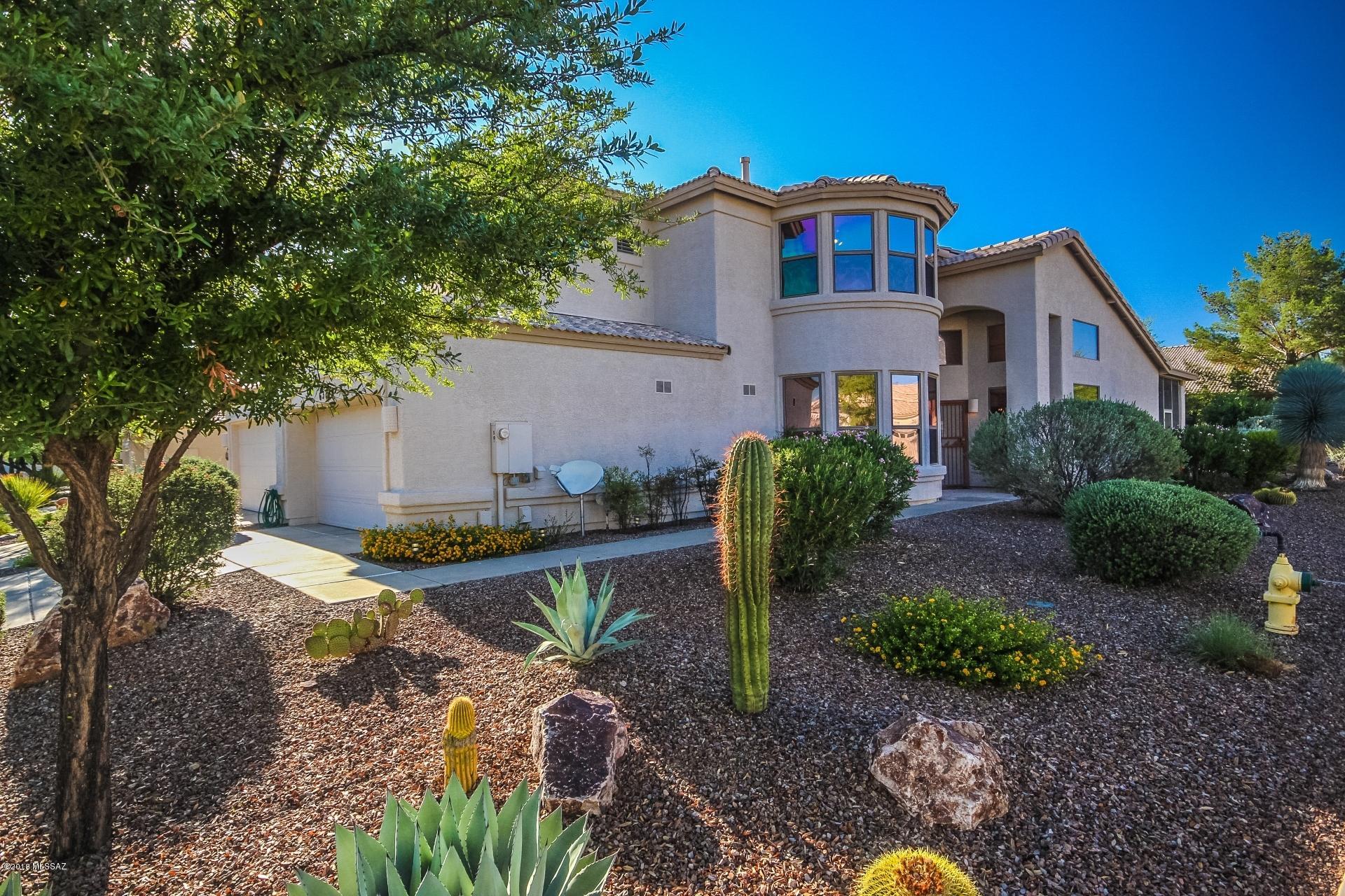 TREMENDOUS VALUE! as Downsize or Investment Property. Enjoy carefree LOCK & LEAVE Villas lifestyle in beautiful St Tropez on open corner lot! PANORAMIC MOUNTAIN VIEWS from architecturally stunning curved walls of windows. Only Villa model with TWO MASTERS & 2x6 construction! No W-facing windows. Entertainers Dream-Great Rm flows to Kitchen, Dining & SCREENED PATIO. Spacious 1st floor master suite w/custom closet. Winding staircase to private guest qtrs & loft den/studio. Perfect for adult child/caretaker. Storage+: lg laundry rm/pantry, oversized closets thruout & garage cabinetry. All SaddleBrooke's world-class amenities: pools, fitness, golf & tennis, dining, entertainment & clubs galore PLUS the benefit of Villas 2 HOA which maintains roof, ext painting, landscaping & pest control.