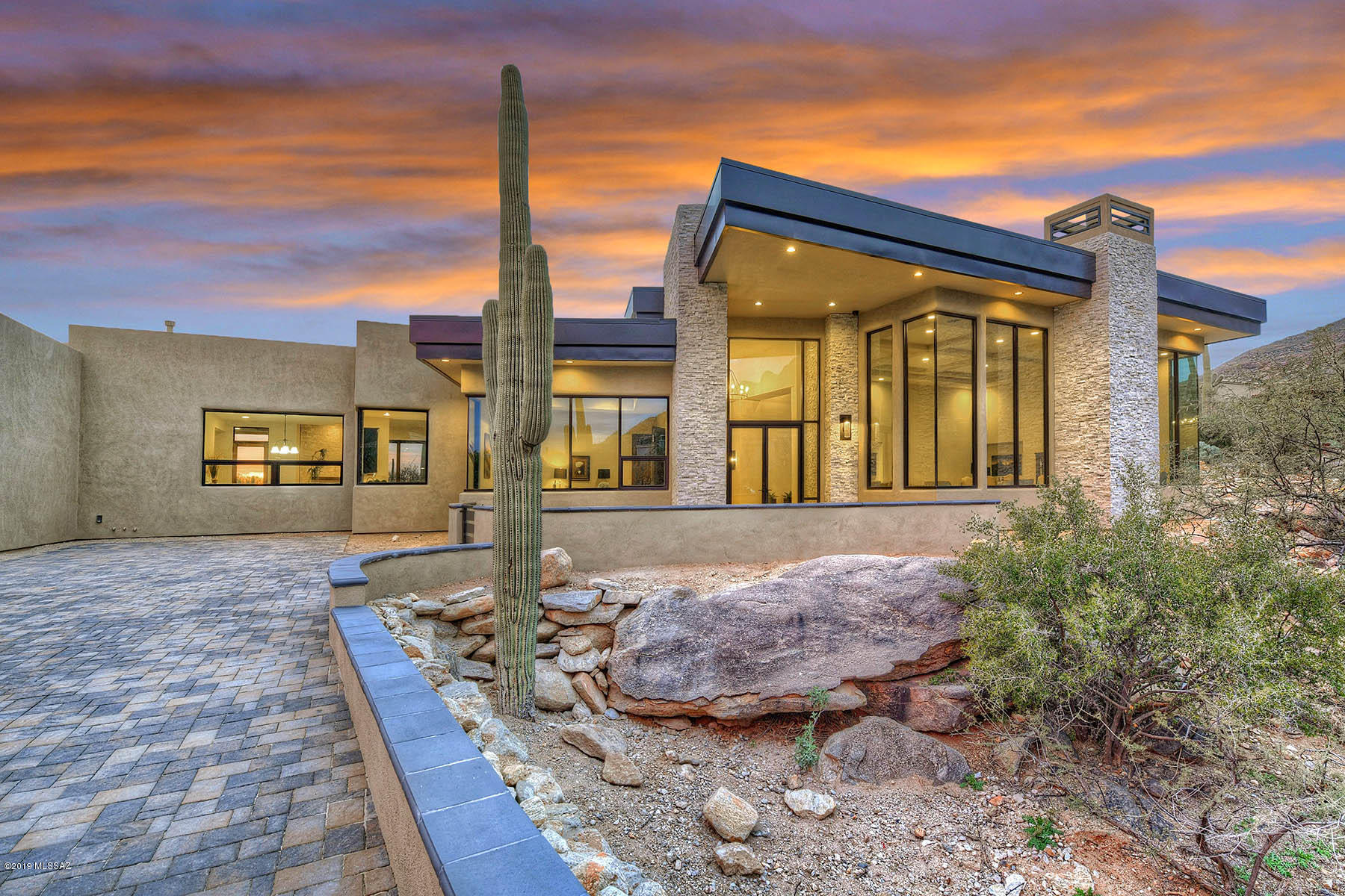 Exquisite NEW CONSTRUCTION Residence in Tucson's Most Luxurious Community - THE CANYONS. Completed in January of 2019 - 5,187 SqFt 3 BR & 4 BA w/ Executive Office Main House & 580
SqFt 1 BR & 1 BA w/Living Rm-Kitchen Guest House. Fine Features Throughout Including Pella Doors & Windows, Oversized Porcelain Tile Floors & Silk Carpet, 8 Ft. Solid Alder Doors, Expansive Walls of Windows Showcasing Commanding Mountain & City Views,Master Suite w/Walk In Cedar Closet, Spa Bath, & Outdoor Shower. State-Of-The-Art Kitchen w/Quartz Island, Granite Counters, Adorn Wiring Under Cabinets, Wolf, Sub Zero & Bosch Appliances, All Opening To Breakfast Area & Family Room w/Oversized Glass Sliders to Back Patio w/Outdoor Kitchen Fire Pit Table & Pool & Spa Overlooking the City Lights! Absolute Showstopper