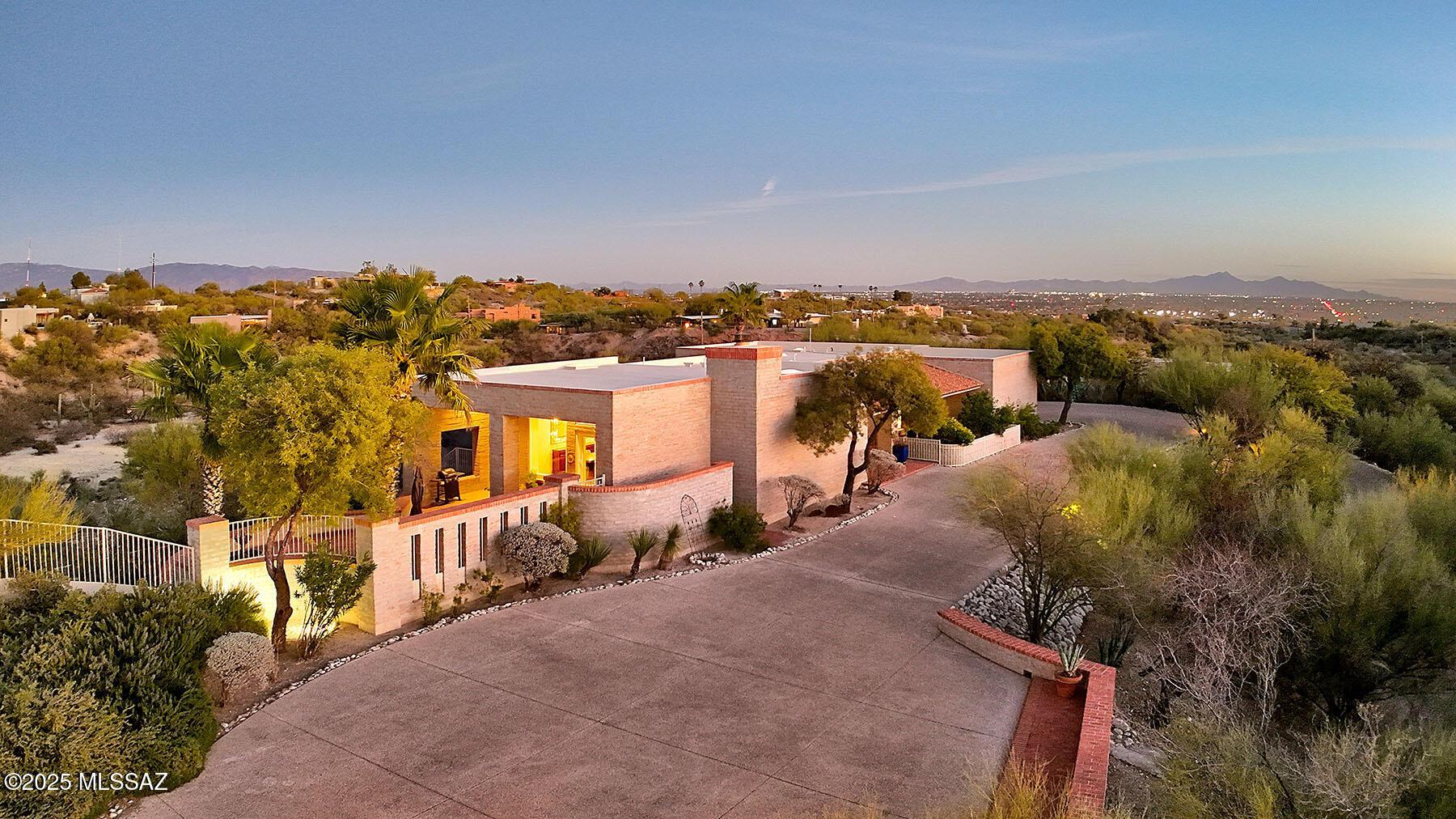 Undeniable Charm in this La Quinta built Burnt Adobe home with attached Casita nestled in the desirable Guard-Gated Community of Catalina Foothills # 10. Situated on a Rare, Prime, 2+ Acre lot with Unobstructed Catalina Mountain Views, this very special 3 Bed, 3 Bath home offers luxury downsizing without sacrificing the best location, views, and privacy. Beautifully updated with all new windows and tile flooring throughout. Kitchen with: Subzero fridge, all other new S/S appliances, quartzite counters, tumbled tile backsplash, under counter lighting & a delightful eating nook.  Great Room with Soaring Wood-beamed Ceilings and Walls of windows highlight the amazing views of Finger Rock /Catalina Mtns. Spacious Primary Bedroom w/ Luxe Ensuite Bath. Casita w/full Bath & Private View Patio. Large Laundry Room with View Window, lots of built in storage plus Computer Desk. Second Bedroom features a large, built-in Murphy Bed with Desk. 
North facing Covered Brick Patio, again with those amazing Mountain Views and a Fountain,  offers perfect space for entertaining --ideal for hosting friends and family or enjoying quiet moments with Nature. NO steps! Quality built La Quinta masonry construction with attention to style and detail ensures long term durability. With easy care desert landscaping this property makes a wonderful full time residence or a lock & leave seasonal home.
Situated on one of the prime lots in this neighborhood with the majority of homes at two to three or more times this price, 3920 E Corte De La Granja is a property not to be missed.