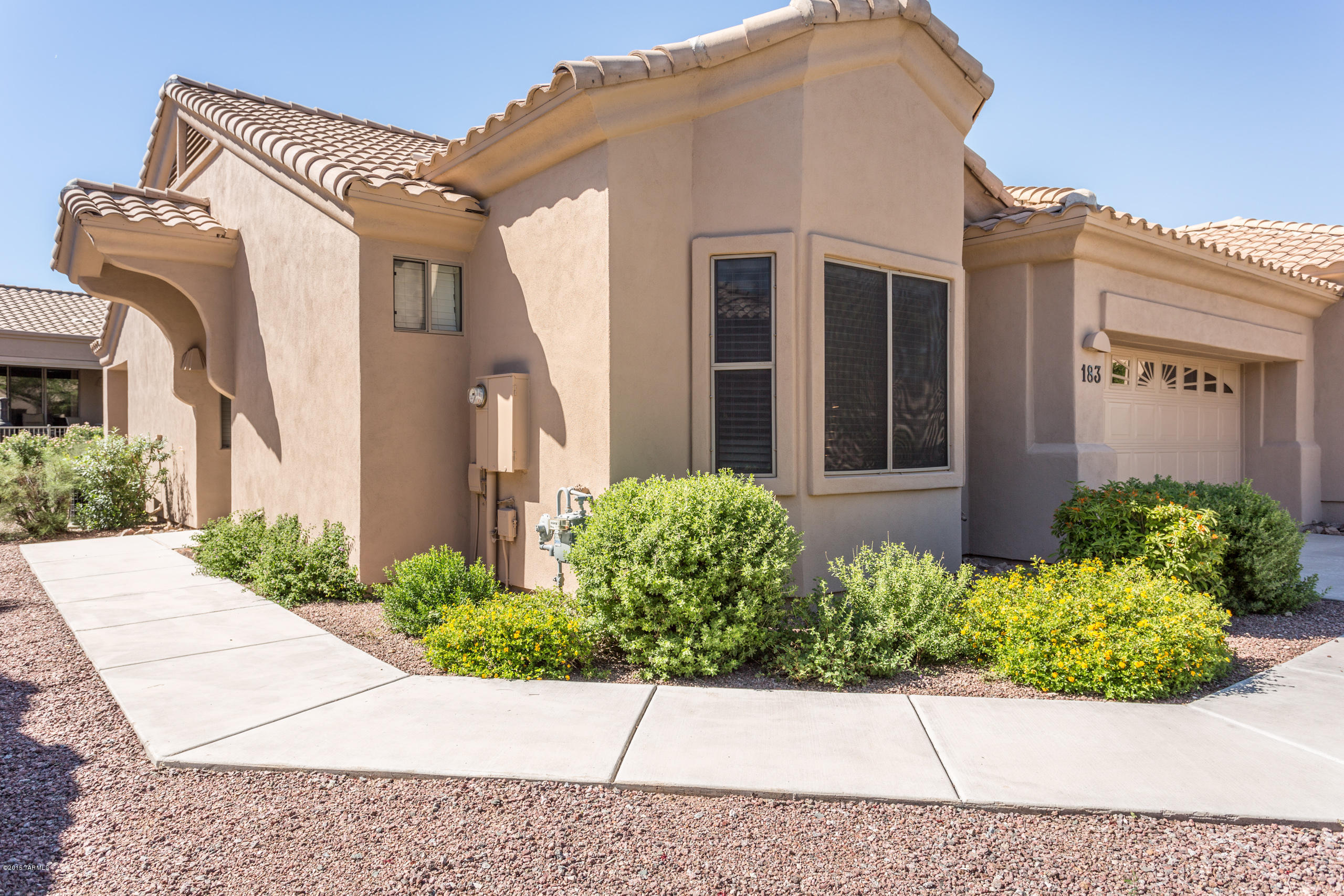 Beautiful 2bd/2ba Alta Vista model Patio Home in a gated 40+ age restricted community in Oro Valley. Home has been upgraded with designer paints,slab granite countertops, 
SS appliances,all tile flooring, executive height bathroom vanities with granite countertops. Master has a bay window, 6' reach in closet plus a walk-in closet with upgraded storage. Guest bedroom has a walkin closet,bay window, and additional entry door to bath. Laundry room has updated washer and dryer with well organized stroage cabinets. Garage has pre plumbed soft water loop and tons of storage. Walking distance to clubhouse and pools. HOA includes water,garbage,sewer,outside pest control,termite control,front and backyard maint.,roof maint,outside paint,clubhouse,and insurance. Seller to include 1 yr home warranty