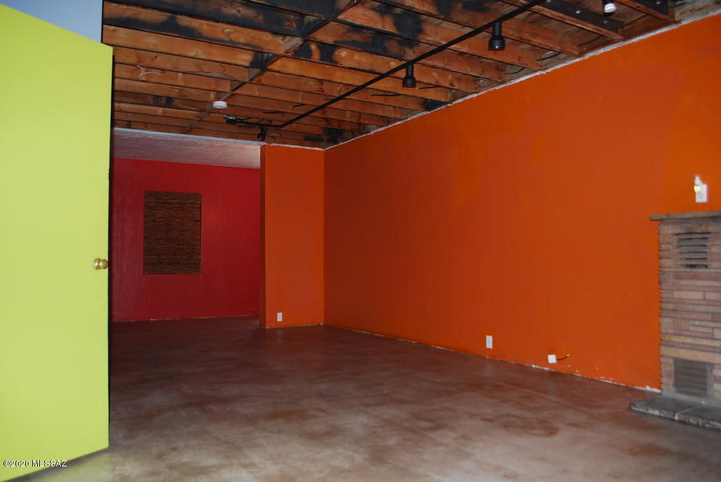 Wildly Colorful and Unique 1 Bed 1 Bath home in Bronx Park. 912 SQ FT. Concrete floors throughout. Stacked Stone fireplace, exposed beam ceilings. Custom Bathroom has a walk-in concrete shower with dual shower heads and linen closet space. The kitchen will come with a gas stove, refrigerator, microwave, and recessed lights. Additional rear space off the living area in the home could be used as den/office or would make a great artist's creative space. A large storage area off the kitchen would be perfect for indoor storage of bicycles. Full-size Washer/Dryer, Central A/C & Heat, Gated entry into front yard with some front patio space, and plenty of room for outdoor furniture. This home is located in a mixed-use industrial/residential neighborhood and borders Hartman Glass and Mirror to the East. Offered as NON-SMOKING. Pets subject to owner approval.