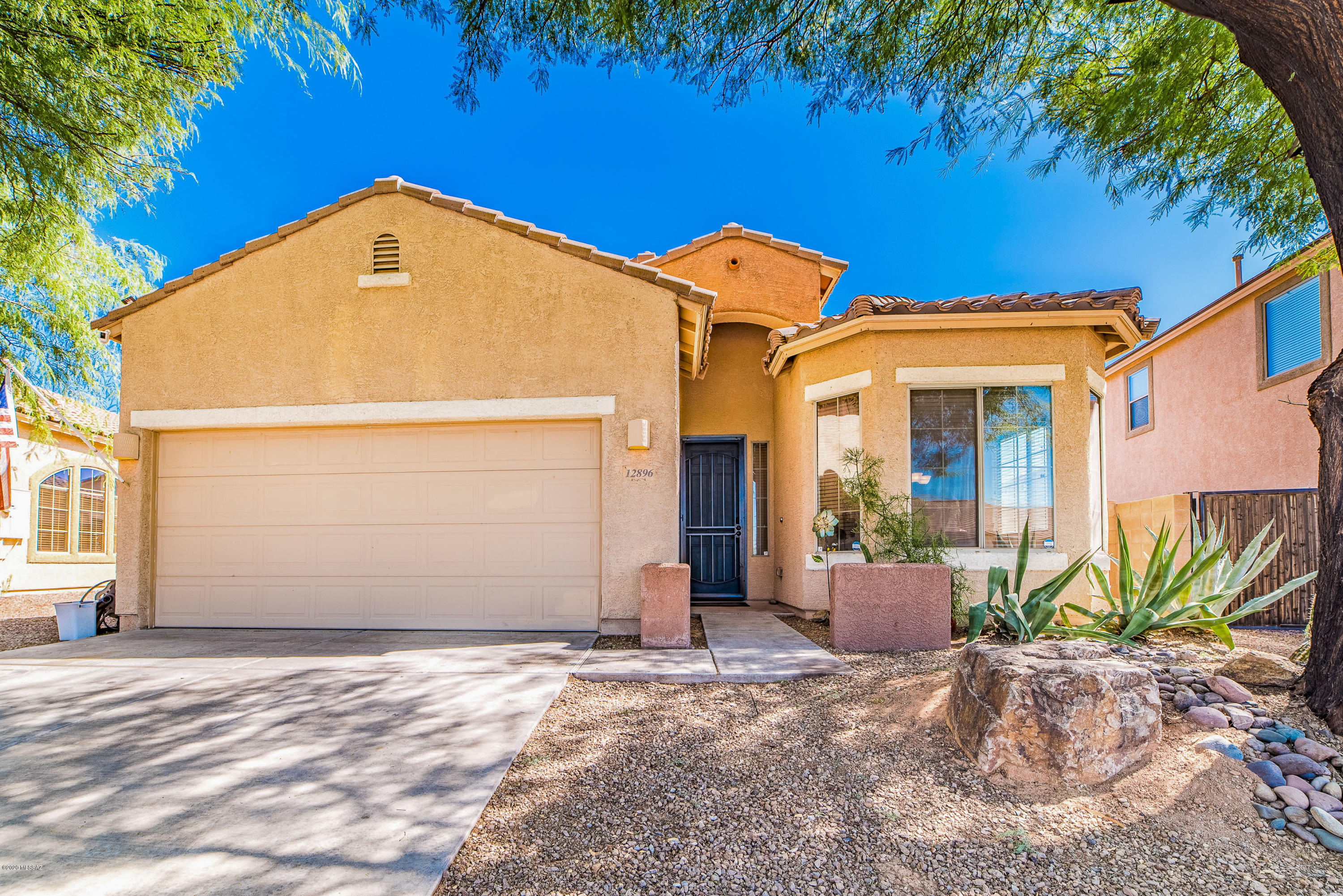Pride of ownership is evident in this move-in ready charmer in a sought-after Oro Valley location! Get ready to be WOWed...new HVAC, fresh paint and efficient leased solar panels are just the start. With 3 bedrooms, 2 baths, an open split bedroom floorplan, high ceilings, large cook's kitchen with stainless steel appliances and granite countertops, and a fully landscaped backyard including mature fruit trees and garden with watering system, this is the perfect place to call home! Situated close to award winning schools, hospitals, shopping and all that Oro Valley has to offer. Must see!