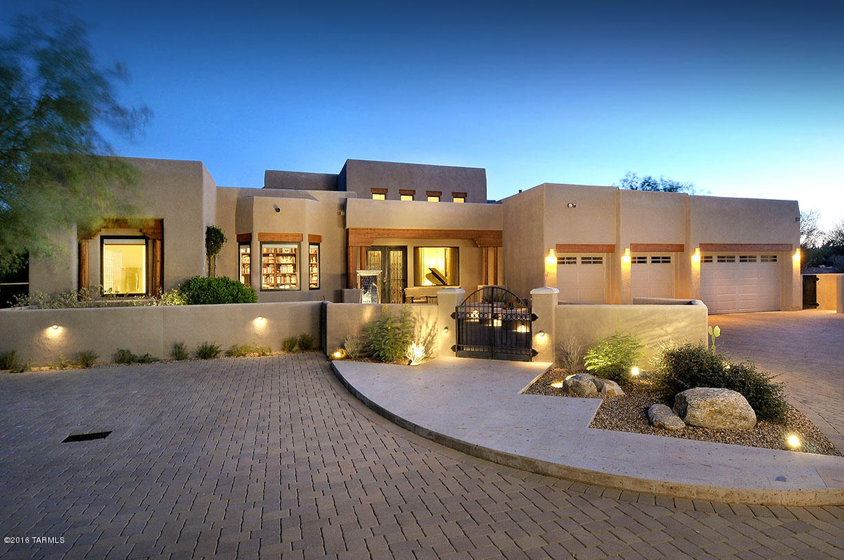 Beautiful Southwestern custom built home located in exclusive gated Pima Canyon Estates.  Entertaining is easy in gourmet kitchen with SS appliances with seating for 8 in wrap around granite bar. Kitchen opens to large family room w/fireplace & onto an incredible lush landscaped backyard w/negative-edge pool w/waterfall, fire pit, natural grass area & built-in covered BBQ area. This home has been meticulously maintained boasting high ceilings and every bedroom with ensuite baths, den w/built in cabinets, large master suite and nothing but quality throughout.