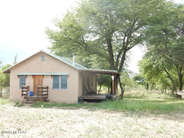 You need a Get Away  This is the one.  Cabin is nestled in Creek Front property with Big Oak, Ash and Sycamore Trees.   Cabin is on 12 Acres with a private well.  One Bedrm, One bath with Vaulted Wood  Ceilings and wood Flooring, Anderson Windows and Patio Doors.  Wood Deck on North side of house looking at the Creek.    Property has another Electric Service  that would be perfect for a RV Spot or another house
