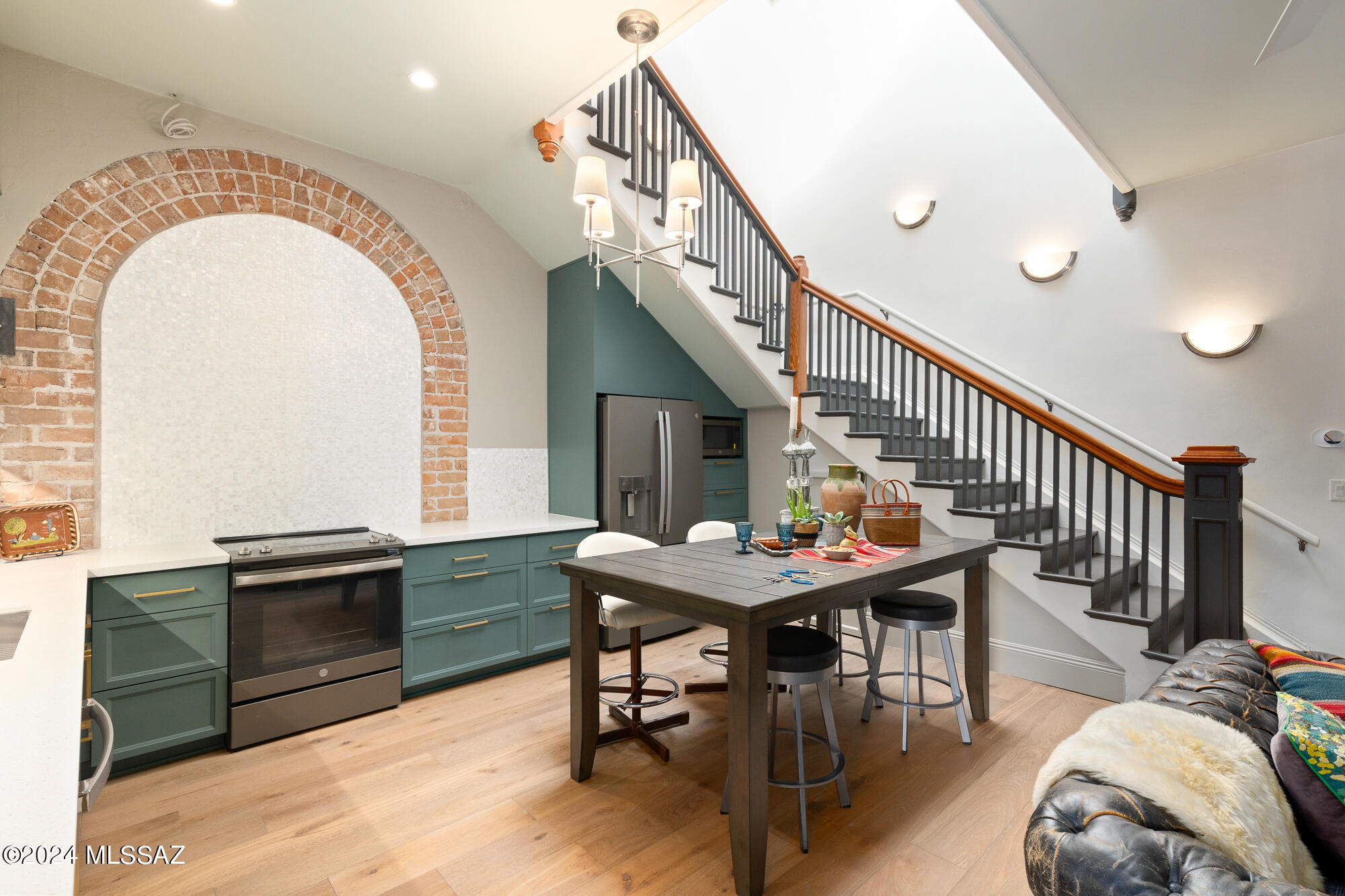 ''The Original'' crafted from the original lobby of the Historic Glenwood Hotel features an incredible pyramid skylight & grand staircase, restored w/minimal changes to preserve the history they represent. Large exposed brick arch anchoring the kitchen was part of the buildings original configuration & serves as the backdrop for modern amenities: custom wood soft-close cabinetry, GE Slate SS appliances & premium Visual Comfort & Robert Abbey lighting. Primary bedroom w/ensuite luxe bath features a dramatic brick arched window framing the view of ''A-Mountain'' while the 2nd floor landing & den/home office showcases the original wood floor (den could also serve as 3rd bdrm) Maximized storage & fabulous repurposed materials infused w/unique modern design throughout.  SEE DOCUMENTS for MORE> See Documents Section for Taxes Explained and Historic Property Tax Program information
