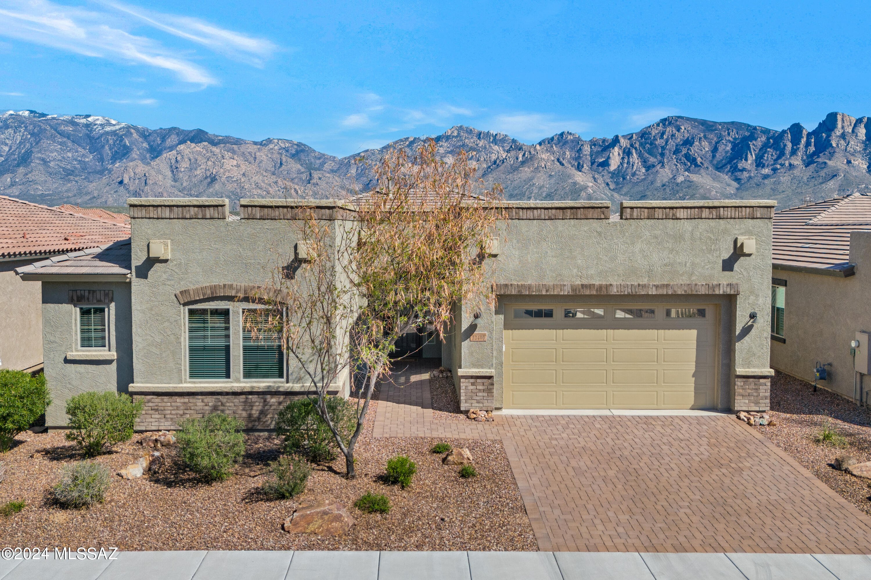 Lovely Patina Model, 3 bedroom + DEN, 3 bathroom, Contemporary home with mountain views in Gated Alterra at Vistoso Trails. High Ceilings, light/bright, open floor plan-great room with Views, kitchen boasts large granite island/counters, upgraded stainless appliances, Walk in pantry, breakfast bar. Porcelain plank tile in main living areas, split bedroom plan with primary bedroom featuring dual sinks, soaking tub, large walk in closet and lovely upgraded shower. Spacious guest bedrooms with a Den that could be a 4th bedroom. Laundry room with sink, 3 car tandem garage with mud room adjacent. Rear yard facing East with Mountain VIEWS, covered patio and just gorgeous. Come take a look-you will love this location!
