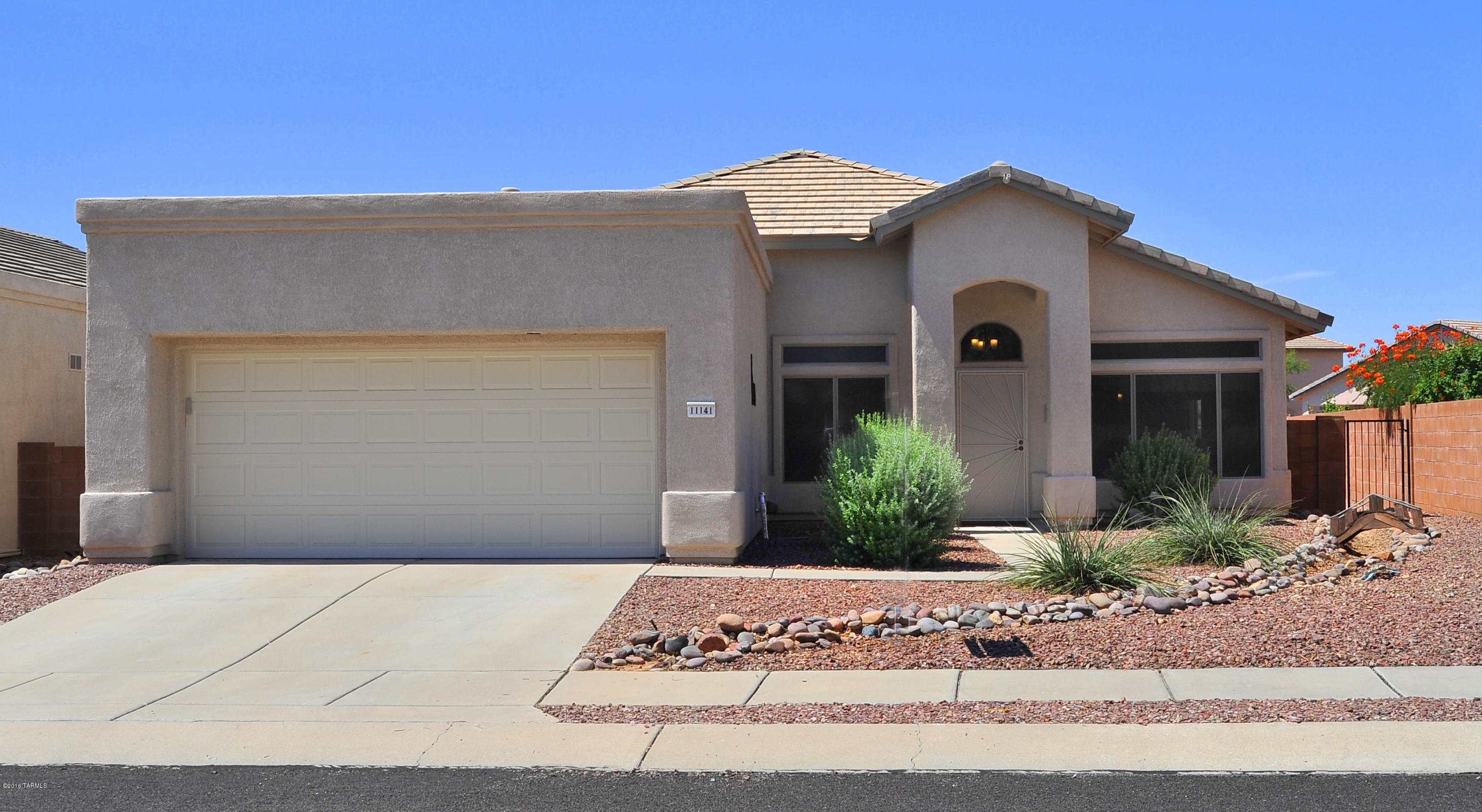 This delightful home will please you from the moment you walk in! Bright and open, the home offers 3BR/2BA, formal living & dining area, along with a Den!  The family room adjoins the kitchen and includes built ins and electric fireplace. Enjoy the additional heat in the winter, or just turn it on for the ambiance!  The kitchen is complete with all appliances, and you'll enjoy the convenience of a dbl oven. Upgrades include replacement of poly piping, new lighting, hot water heater, new insulated garage door, and irrigation. Outside is an inviting covered patio with elec shade & a yard that is enclosed by view fencing which backs to natural desert.  Convenient to shopping, theaters, and within walking distance to the community center. Be sure to come see this one. The Master Suite includes a large bath with garden tub and separate shower.  There's a huge walk in closet as  well.  The home has been beautifully maintained!