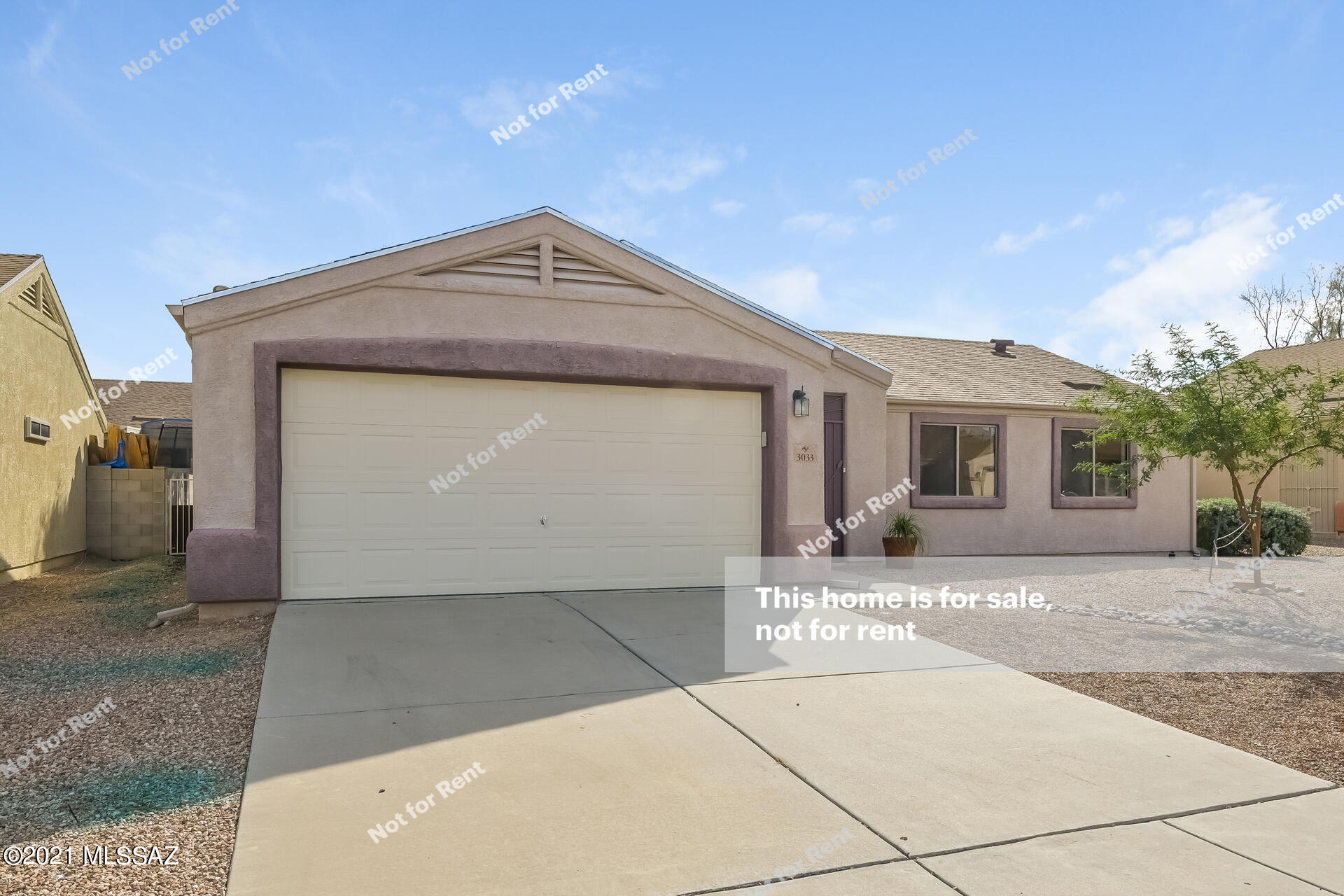 This Tucson one-story home offers a patio, and a two-car garage.