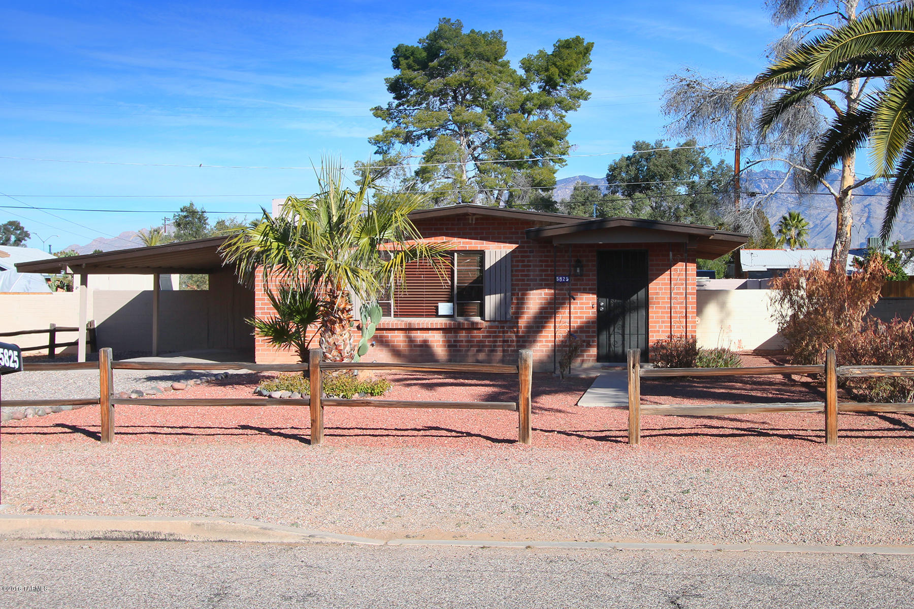 Charming centrally located brick rancher on a quiet street minutes from shopping, schools & bus lines.  Updated to provide large, open light-filled living through the walls of windows, vaulted ceilings and light, neutral color accents of the wood flooring and rich granite counters in the kitchen.  The all new kitchen features an abundance of rich wood cabinetry highlighted by stunning granite slab counter tops, stainless steel appliances and hardware further enhance the space.  A large breakfast bar is offered as well as additional eating area.  The romantic master suite includes its own private bathroom, walk-in closet and sliders leading to the large yard.  2 additional spacious bedrooms wit plenty of storage and a full-size bathroom complete this charming home.  Large yard w/MTN views.