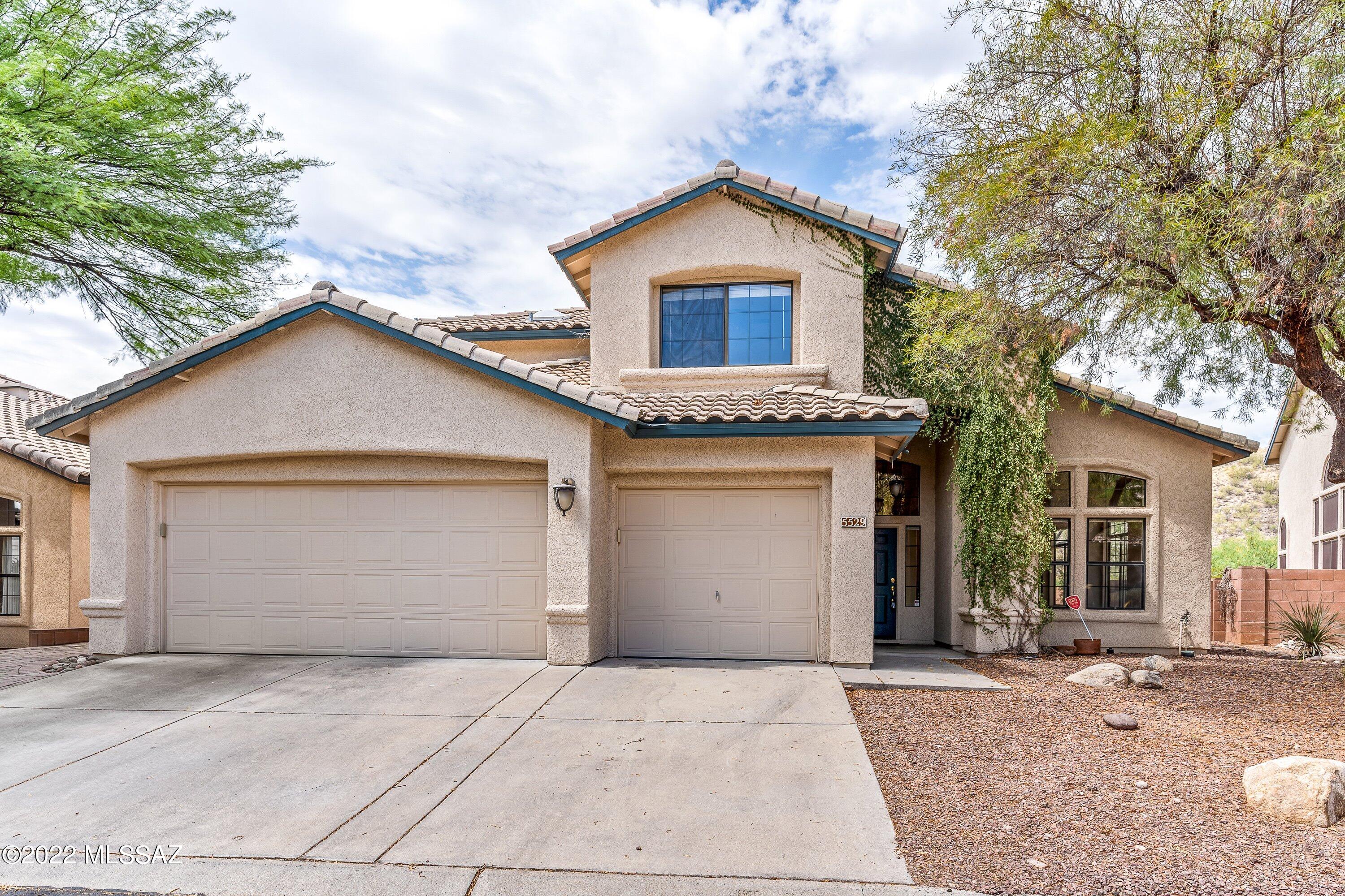 Gorgeous 4BD/3BA home located in the Catalina Foothills.  Terrific and sought after floor plan features open kitchen/family room, 1BD and 1 full bath downstairs, laundry room with washer/dryer included, laminate flooring, living & dining room.  Large primary suite upstairs with a private patio, walk-in closet, garden tub and separate shower, duel sinks. Beautiful gated pool, views and privacy in the backyard.  Three car garage.   This is a must see!  District 16 schools.