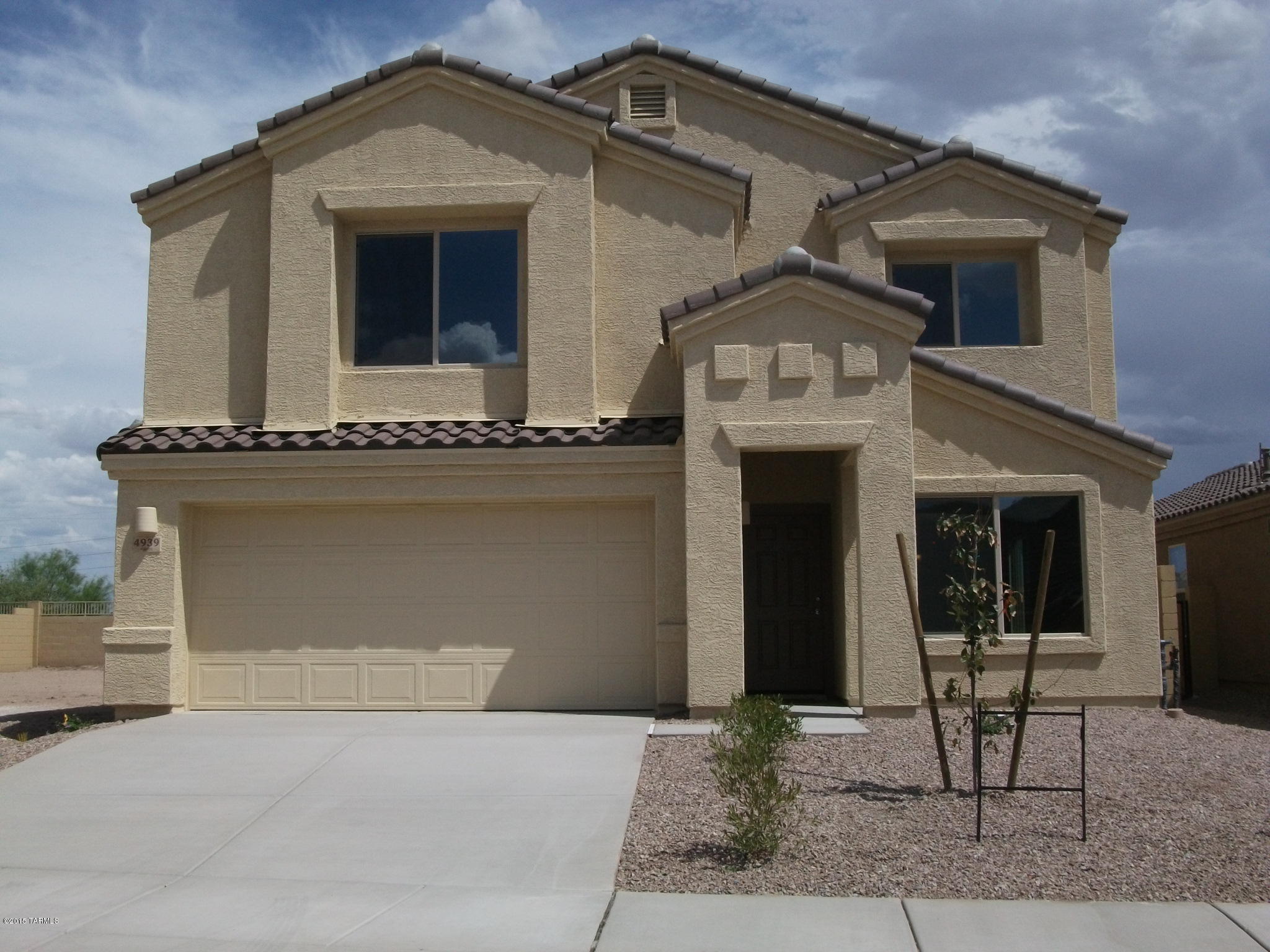 This impressive home features formal living and dining, large eat-in kitchen with island open to a spacious family room.  Rich Coffee Maple cabinets, stainless steel appliances with gas range, walk-in pantry, attractive floor tile, upgraded carpet pedestal sink with oval mirror at powder room, upgraded light fixtures throughout, rounded drywall corners, generous loft upstairs and majestic master retreat including the walk in closet of your dreams!   Covered patio with generous sized walled-in yard backing to a wash.  Fully finished 2 car garage with door opener and remotes!  Easy access to freeways, Raytheon, airport.  Hurry - won't last long.