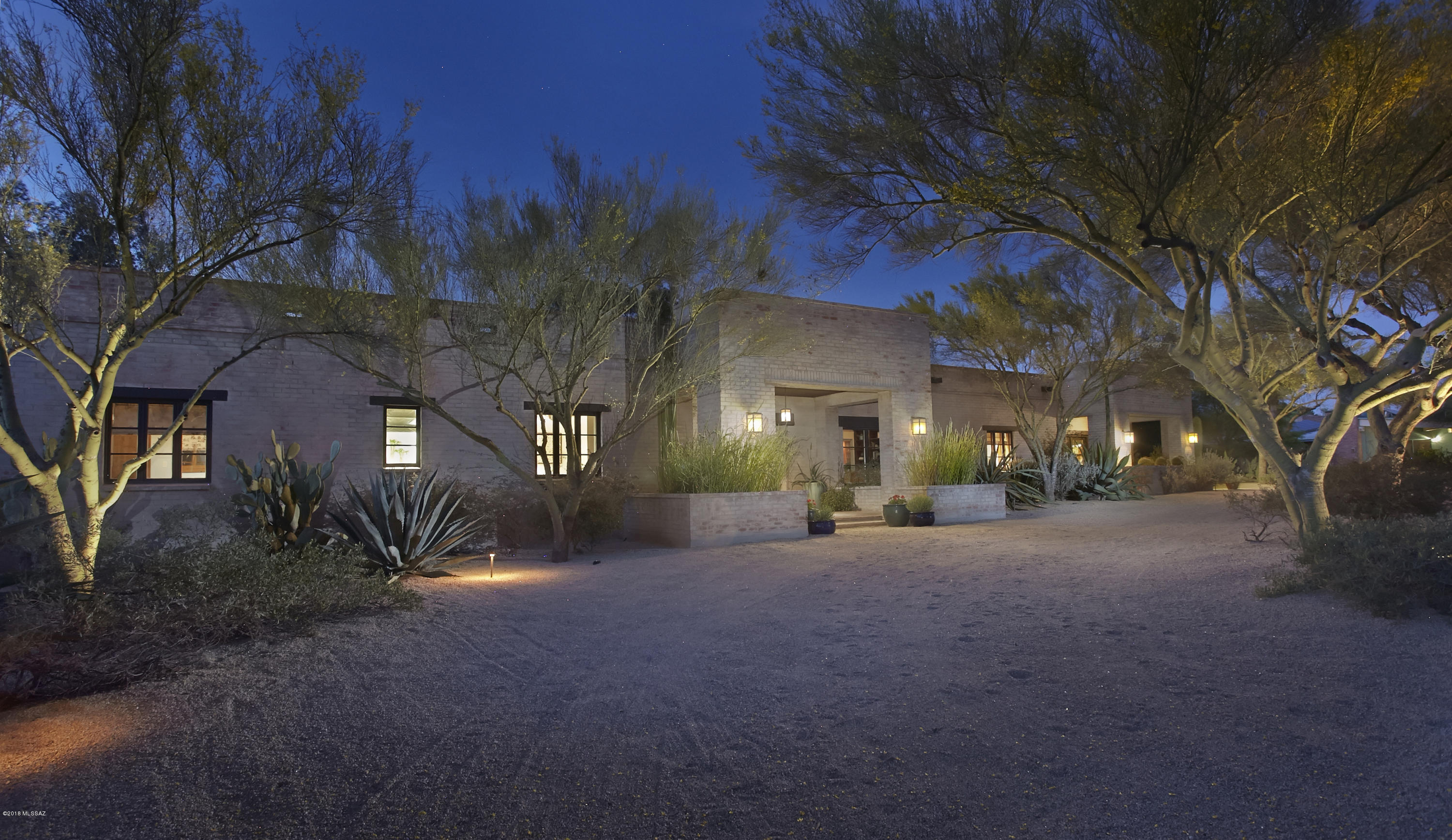 Location, Location, Location! This absolutely stunning remodeled masterpiece located one block from the Historic Arizona Inn & one block from Banner UMC epitomizes classic Tucson charm & understated elegance. This 4,400 square foot, 4 bedroom + den home, remodeled by Alexandra Hayes, features double brick construction, concrete tile floors, new Jeld-Wen custom doors & windows, beamed ceilings & a stunning gourmet kitchen w/butlers pantry. The elegant dining room features floor to ceiling windows & is ideal for entertaining. The master suite features a spa like bathroom & opens onto an expansive covered patio overlooking the sparkling pool & beautiful grounds. 3 car garage, outdoor kitchen, outdoor shower & roof deck complete this rare, hard to find package!