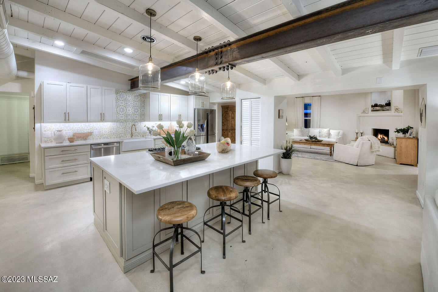 A home in historic Indian Ridge that is  spacious and updated to perfection...  well they rarely come along.  Visualize open living that seamlessly flows from one living space to the next.  The kitchen is by far the ''heart'' of this home.  An island that calls to everyone to gather around.  There is a one of a kind iron beam that anchors the home in such a unique (and incredibly) designed way.
An elegant separate office is just one more special part of this home.  LoveA that one bedroom with ensuite bath is perfect for guests or perhaps a teenager that is best tucked away.  Owners suite is simply beautiful.  A backyard oasis complete with pool, waterfall, and patios.  Don't miss the huge seperate yard that can be anything.... pickleball, soccer, or just plain ole relaxation. Do not miss