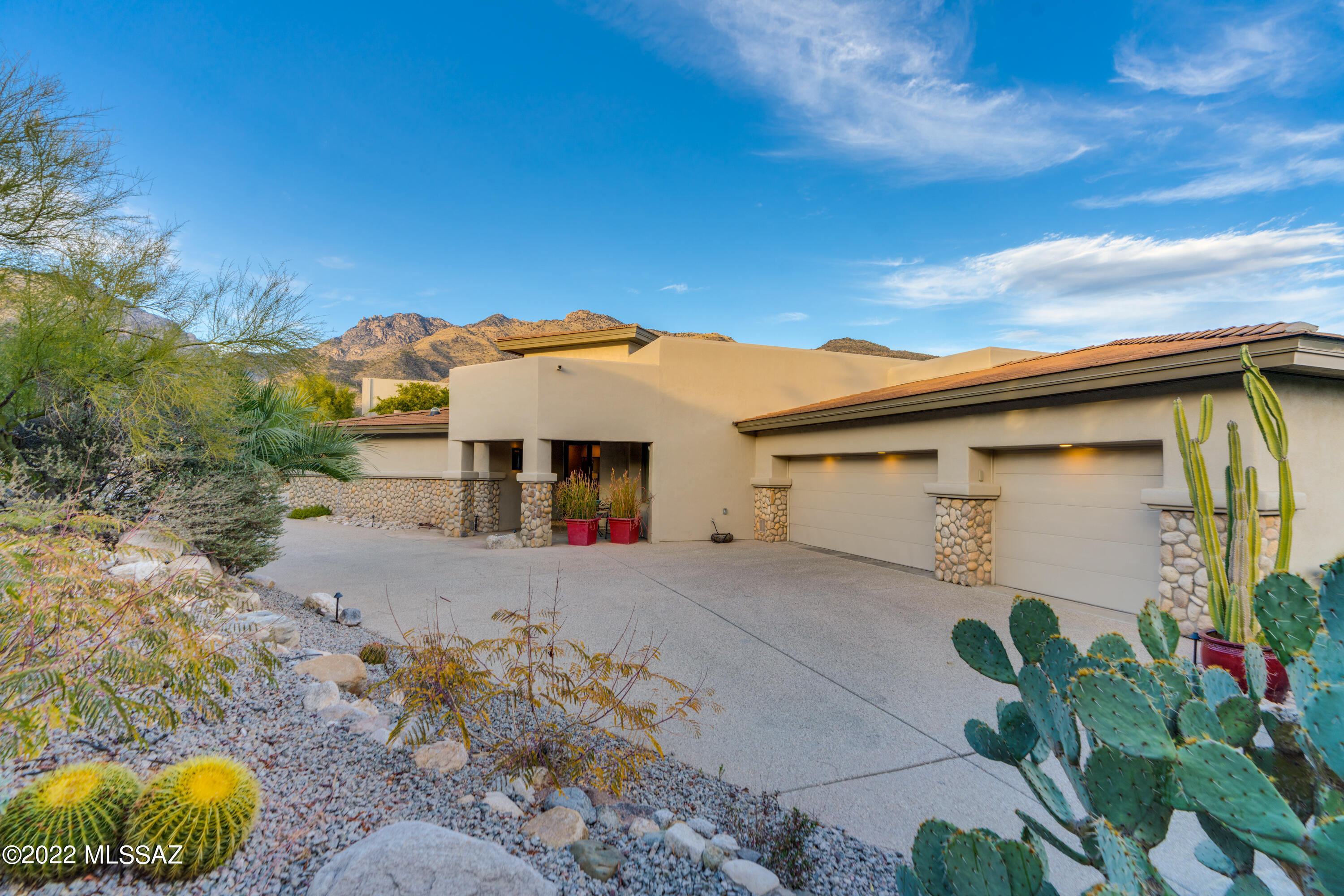 Welcome to luxury real estate at its best! Located in the prestigious Ventana Canyon Community, the property is among the finest homes in Tucson. Tucked away, distinctly private and quiet, this estate greets you with soaring ceilings, panoramic windows and commanding views of Santa Catalina Mountains and a world-class golf course. Impressive great room with exquisite natural stone flooring will take you onto immense deck with breathtaking mountain views and BBQ area. Newly renovated, gourmet kitchen boasts state of the art cabinets and appliances, quartz countertops, enormous island and more mountain views. Spacious master suite has direct access to the deck, mountain views, luxurious bathroom with large soaking tub, walk-in shower and a huge, new custom designed and built walk-in closet. The house has a comfortable split floor plan with the living areas and master bedroom on the main floor and all guest bedrooms and an office on the lower level. This home was designed to offer the highest level of comfort and privacy for its owners and to make the most discriminating guests grateful. Private, beautifully landscaped backyard includes covered patio, expansive flagstone terrace, sparkling spa and endless heated pool. Santa Catalina and Rincon Mountains vistas are the cherry on top! Two HVAC systems (2 zones) were replaced with new energy efficient equipment in 2021 to keep the new owners comfortable year-round. The third AC unit was replaced in 2018. The entire house was repainted in 2021 (interior) and 2022 (exterior). The upper deck was resurfaced in November of 2022. Ventana Canyon Community has world class amenities and picture-perfect grounds. The estate is within minutes of excellent restaurants, grocery and the beautiful Sabino Canyon Recreation Area. Welcome to paradise! A complete list of home improvements, floor plan and additional photos are available in the Documents section of the listing. Furnishings are available with a separate bill of sale.
