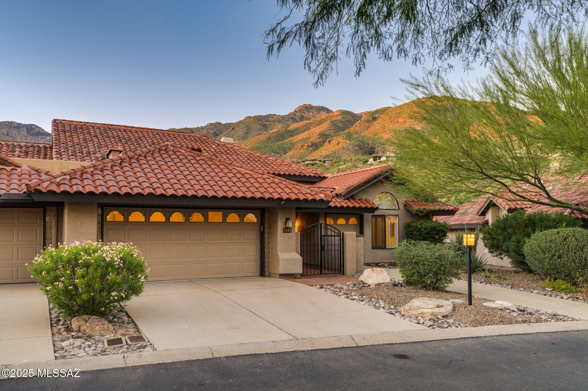 Impeccably remodeled home, perfectly situated on the 5th fairway of Ventana's Mountain course with Stunning views of the Catalina mountain range. Ventana Canyon Lake Estates is a small subdivision tucked back into Guard Gated Ventana Canyon County Club with lovely tiled roofed town homes. This single story, totally remodeled, open concept floor plan, has vaulted ceilings, 3 bedrooms & 2 full bathrooms with 2186 Sq feet of luxury living. Kitchen with Quartz countertops, stainless appliances, island sink, Modern cabinets & drawers. Primary bedroom is large with high ceilings, access to the back patio, bathroom with soaking tub, separate glass walk in shower, modern surrounds, Quartz Countertops, dual vanities and premium lighting. Tankless water heater, water filtration system, a two full car garage plus one golf cart garage, and Catalina Foothills Schools all inside a very popular resort community with Golf, pools, tennis and more.  See attachments for more details