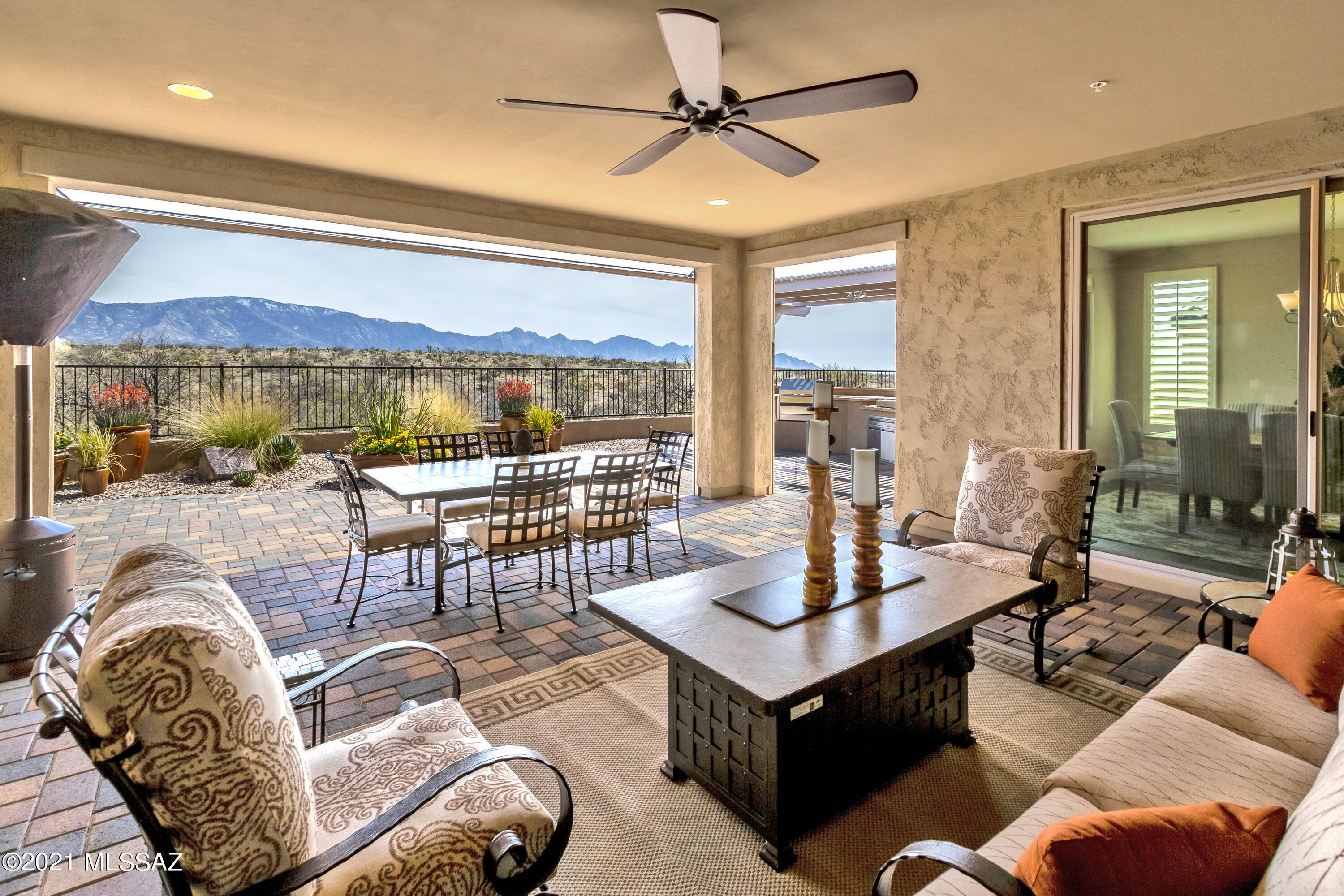 Luxury living is yours in this rare gem, a Tesoro model with spacious casita. Pristine panoramic desert & mountain views.  Open the sliding window wall to the beautiful outdoors and watch the game on your shady paver covered patio.  Inside you will find the premium upgrades you would expect – kitchen with granite countertops, butler's pantry, induction cooktop, convection/microwave combo, built in refrigerator, great room with buffet & wine cooler for easy entertaining, curbless shower & tile shower surrounds in the master bath with two walk-in closets, a den with an elegant built in wood desk & credenza combo, full 3 car garage w/over height doors &  4' extension.  All this plus the resort amenities of Saddlebrooke Ranch.  Why build new when you can have it all today?!