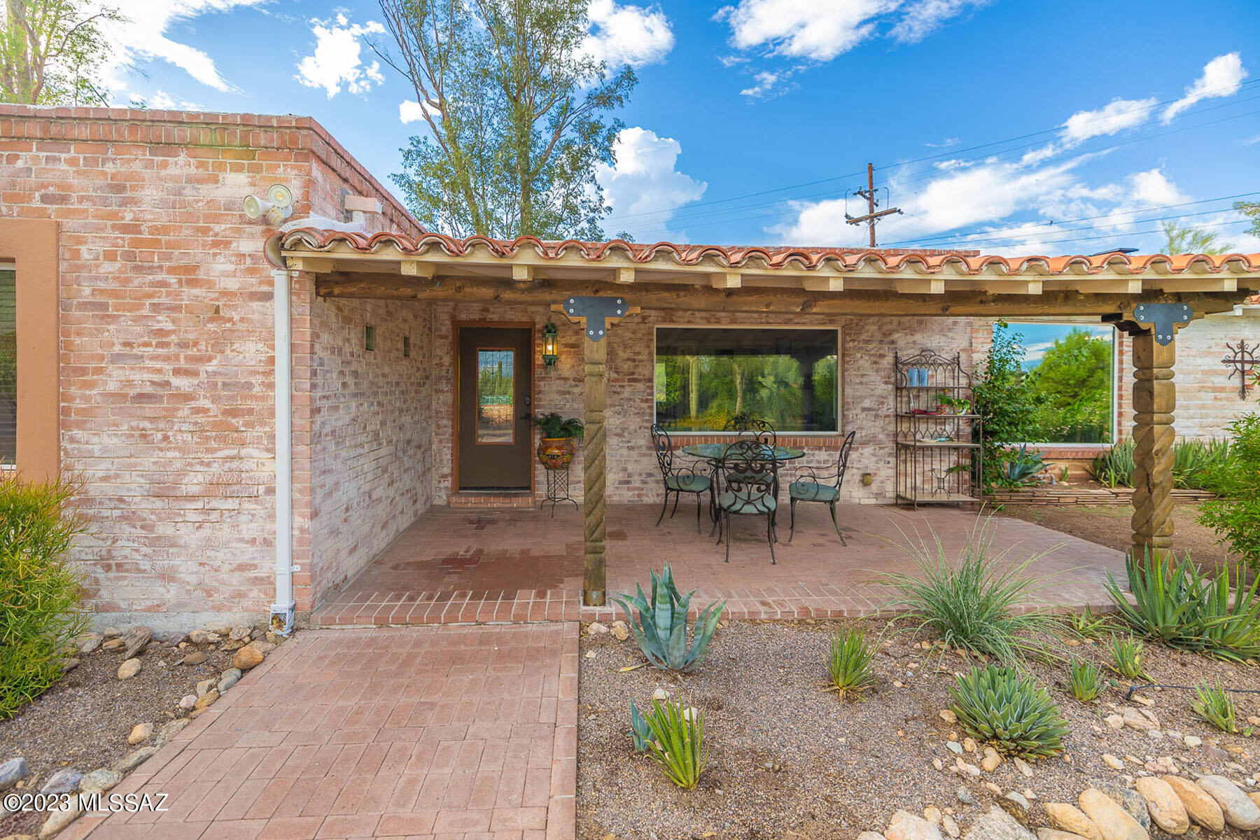 This One-of-a-Kind property Once owned by nationally recognized artist Noel Daggett whose original signed art is integrated into the home exudes Classic
Old Tucson Charm with Carved Posts Entry, Brick & Saltillo Flooring, Wood Beamed Ceilings, Hand Painted Archway, Wood Burning Fireplaces in the Living Rm, Kitchen & Master Bdrm & Mexican tiled Bath and are just few of the many details! The recent remodel retained all of the Old Tucson flavor. The stunning Kitchen has solid Mesquite Cabinetry, Mexican tile accents & large viewing windows. Cozy up in the large Master Bdrm & enjoy your own private Patio. Beautiful Master Bath continues the Old Tucson Charm with Double Wood Carved vanities. In addition to the beautiful 3 Bdrm, 2 Bath Main house, the property boasts 3 additional Guest Homes!