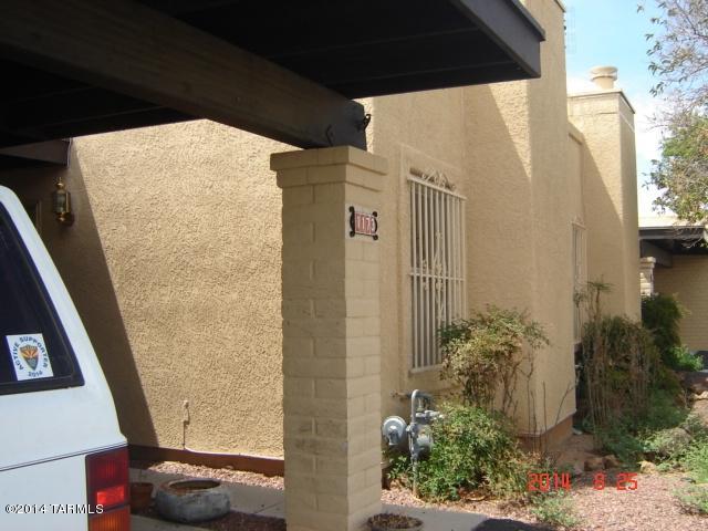 Cozy 2 bedroom with fireplace in living room. Small backyard & covered patio.