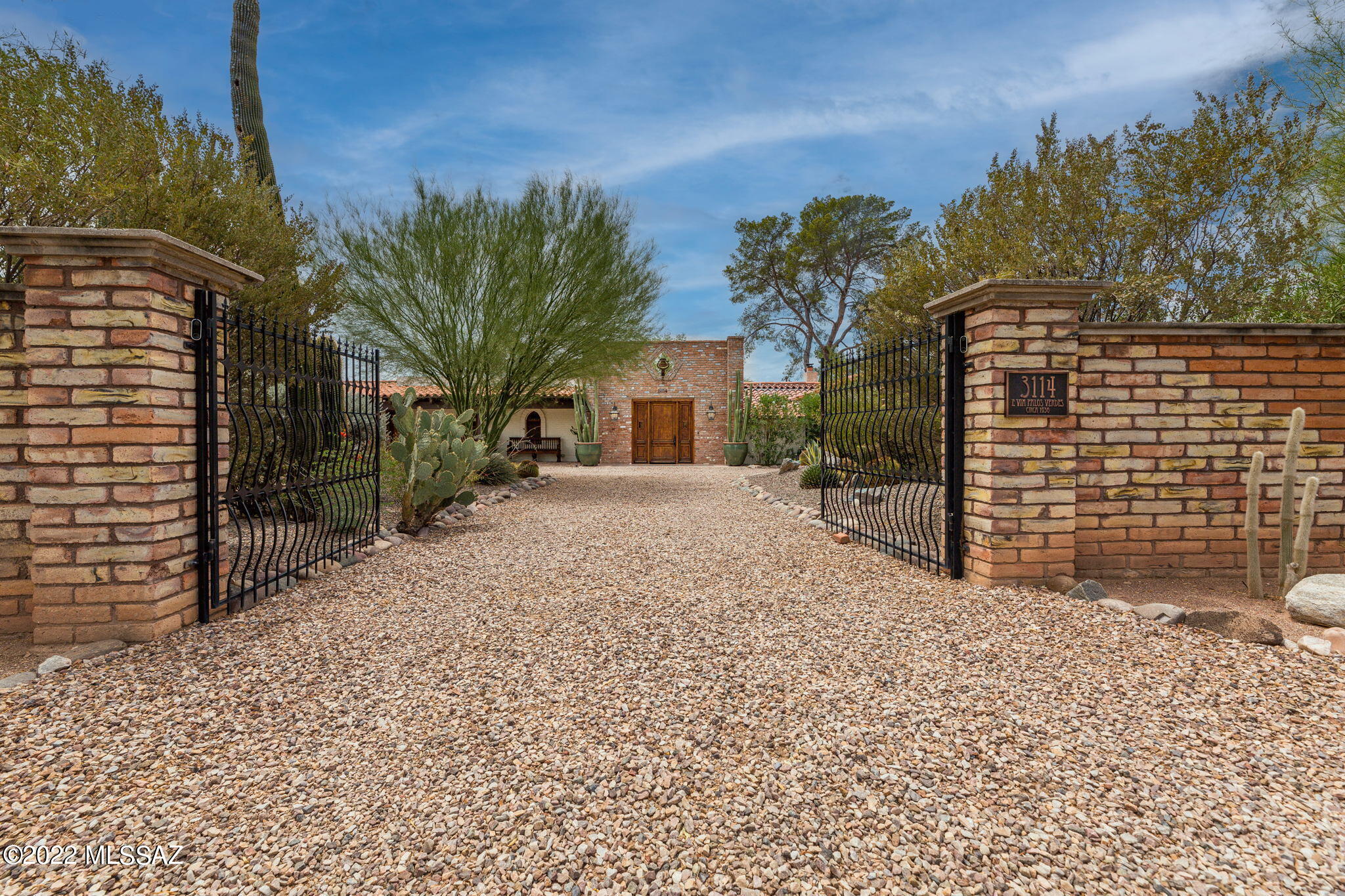 Stunning historic estate designed in 1936 by celebrated Tucson architect, Roy Place. Fully restored in 2020-21 & located on a completely gated/walled 1.15 acres in desirable Colonia Solana. Entertainer's delight! Turnkey property boasts 5,324 sf of living space w/ total of 6 bed/8 bath, including attached 1-bed guest house w/ full kit/ba/lndry, as well as a guest casita. All new plumbing, roof, & electric service (400A); Updated lux copper kitchen; Updated baths; Resurfaced pool/spa+new heater+filter; Dedicated HVACs in bedrooms + guest houses; 18 security cams; Hardwired (CAT-6e); 3 EV chargers; App controlled lighting; New irrigation+landscape lighting; the list of improvements is endless! Located adjacent to Reid Park/Zoo, Hi-Corbett, Randolph golf, El Con, and just 6 min to UA & dwntn