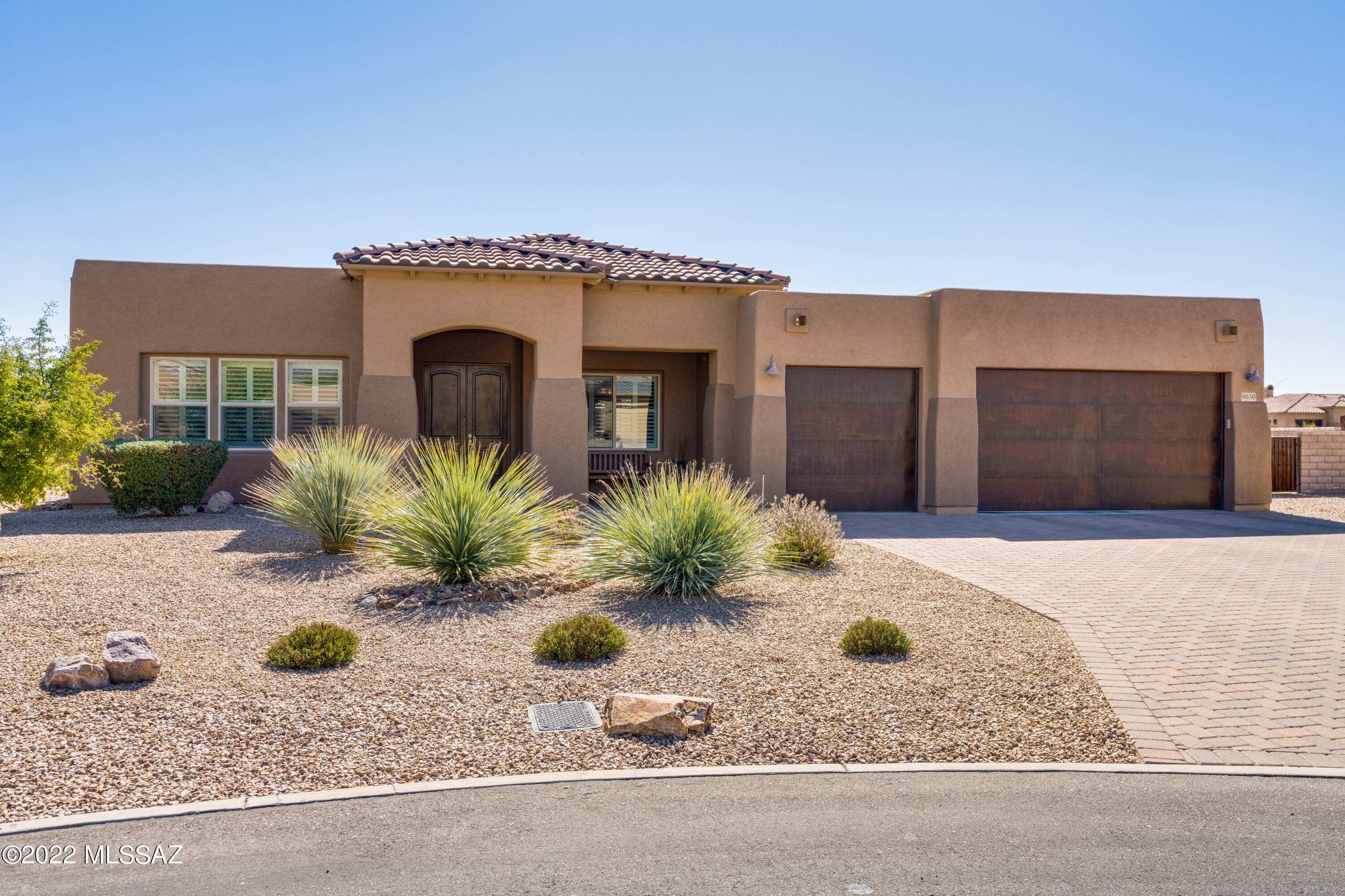 Extraordinary views of the Catalinas and Rincons from this exceptional Tanque Verde Valley home. Open floor plan features great room, formal dining, flex room. Gourmet kitchen boasts upgraded cabinets, counters & appliances. Luxe master suite has soaking tub viewing mountains, separate shower and walk-in closet. Upgrades throughout this amazing home include custom shutters and Hunter blinds, retractable sunscreens,  abundant tile flooring, custom rusted metal garage doors, ceiling fans throughout. Coveted half-acre lot is professionally landscaped w mature citrus, drip irrigation, outdoor kitchen w BBQ grill, sink & refrigerator, fire pit, extended back patio w pavers hardscape. Lot is situated in cul-de-sac adjacent to riparian area with no shared walls.