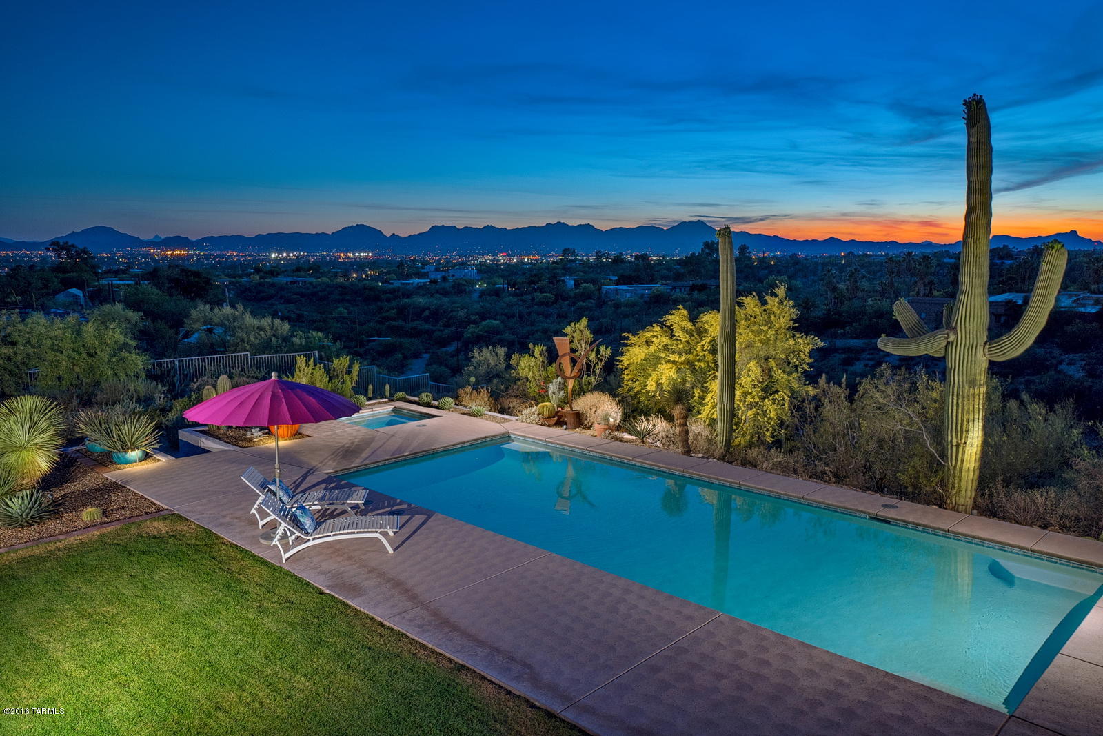Breathtaking & panoramic mountain, city, and sunset views are perfectly showcased throughout this 4,861 sq. ft. striking, modern estate. Situated on a 2.41 acre lot this masonry constructed home was designed in the styling of distinguished architect Louis Barragan. The sleek, modern kitchen features a Sub-Zero refrigerator, Miele appliances, an oversized island w/ Silestone countertops, and custom SieMatic cabinetry. Renovated baths with Vola fixtures complete the contemporary styling throughout. A climate controlled basement wine room holds 750 bottles for a true wine aficionado. Enjoy & relax in the backyard oasis gazing out at the saguaro studded landscape and twinkling lights. You won’t want to miss this impressive estate!