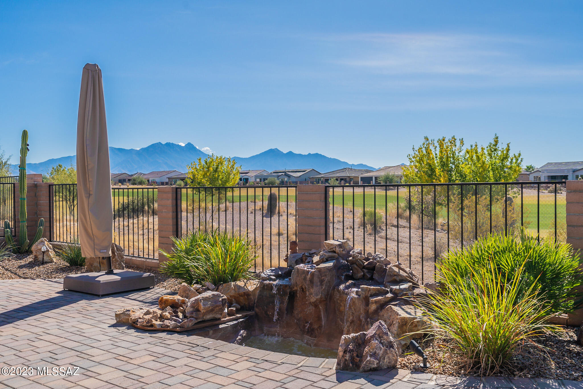 ELEGANCE AND LUXURY ABOUND w/SPECTACULAR MOUNTAIN VIEWS on GOLF COURSE LOT! 3BR, 2.5BA, 2954sf. This two-year old Avalon boasts $432k of sophisticated options and upgrades that feaure Wolf kitchen appliances, custom built-in Miele refrigerator, Miele coffee maker and Miele wine cooler, alder soft-close cabinets, and a timeless backsplash. Primary bedroom has spacious en-suite bath, huge closet and a heat lamp. Third bedroom is used as an office, but easily converts back to a bedroom. Large extended den. Tile & wood throughout. Custom landscaping includes a putting green, rock waterfall, extended paved patio, built-in gas grill, electronic screens, and fully walled backyard. Front courtyard too! Custom-built cabinets in 4' EXTENDED FULL 3-car garage w/epoxied floor. So much more. Visit!