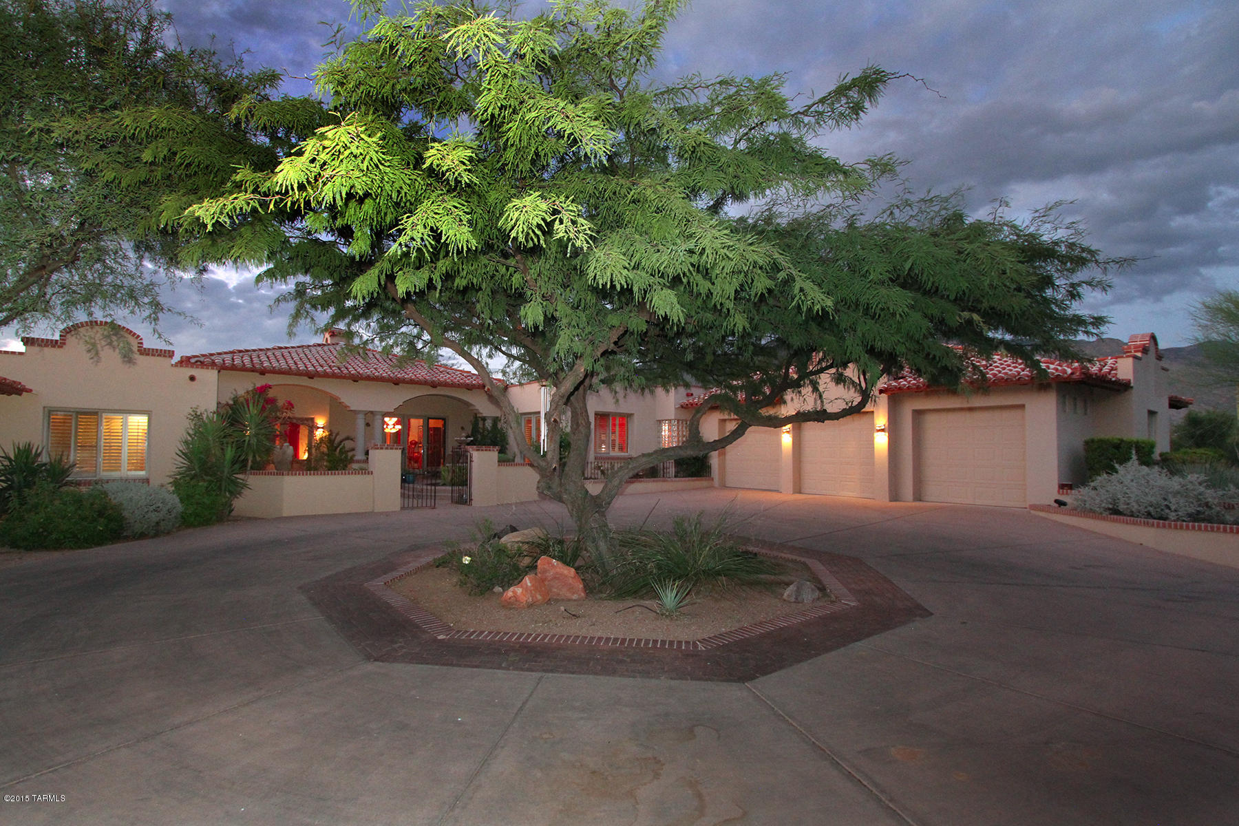 This Mediterranean family estate has 5 bedrooms, 5 baths, and 3 car garage. Located in the gated community of La Paloma Estates. Built for endurance, this quality masonry home offers charm and functional design for comfortable living.  Features include:  split bedrooms design, formal living/dining room, family room off kitchen, breakfast nook, gourmet kitchen with built-in refrigerator, Fisher/Paykel dish washer drawers, granite counter tops, 4 fireplaces, 3 new Lennox HVAC systems, roof was recoated/repaired, Pella windows and exterior doors, solid wood interior doors, ideal north/south passive solar orientation of the home, new pebble tech pool surface, built-in barbecue, travertine pavers in patio, situated on a private 1.2 acre lushly landscaped home site with pool and spa.
