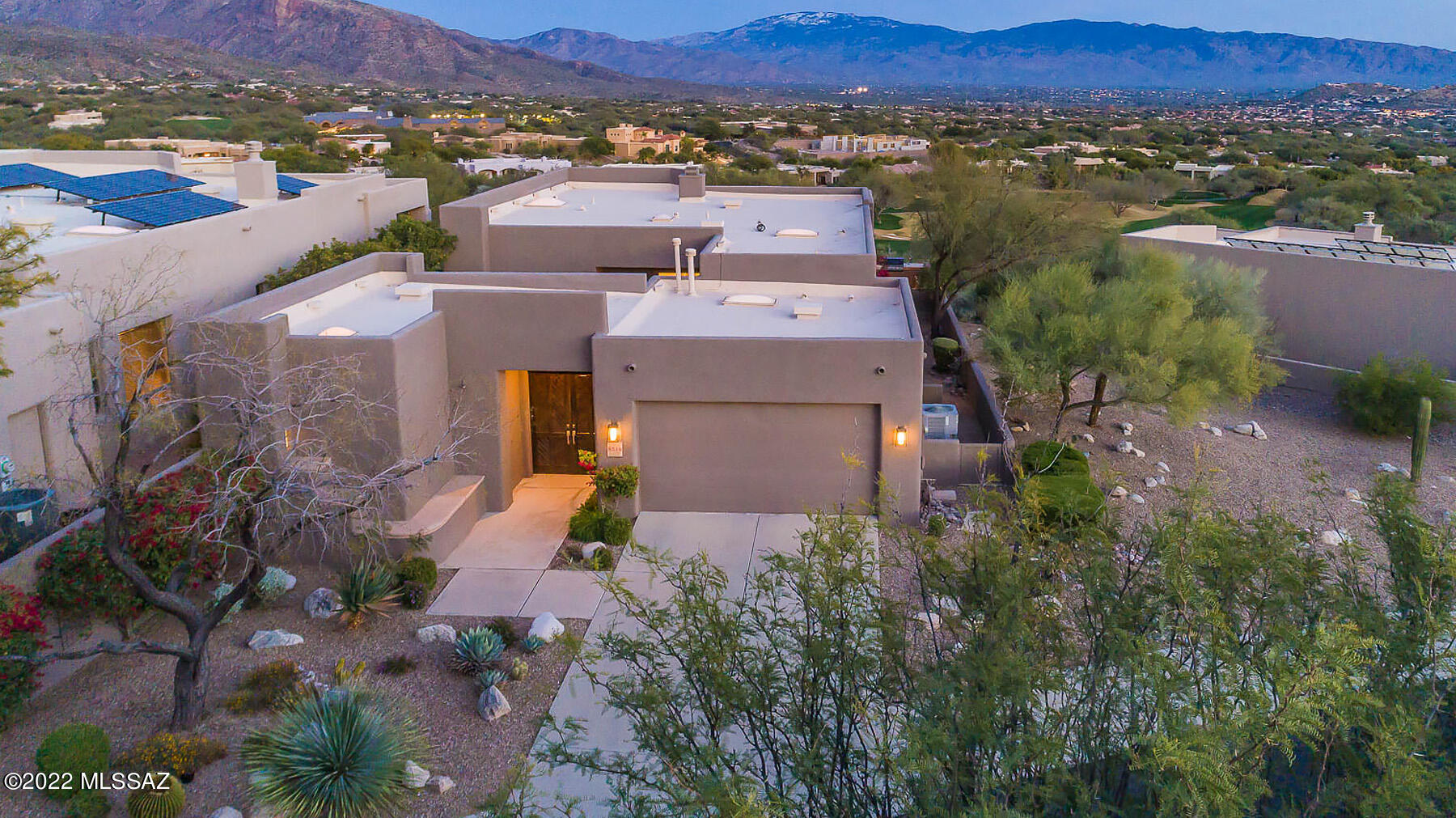 Located in the prestigious gated community of The Ridge at Ventana Canyon on a premium, elevated lot- this 2218-sq. ft. contemporary delivers unparalleled privacy & panoramic city, mountain, & Ventana Canyon golf course views. Lush, private courtyard greets you upon entering 3bed/3bath home, recently upgraded w/  immaculate finishes. Home highlights private guest casita, multitude of windows allowing an abundance of natural light, & Turkish Calcutta marble tile + floating White Oak hardwood flooring throughout. Chef's kitchen w/ quartz countertops, new Dacor & GE SS appliances, & opens to dining/living areas. Primary suite w/ spa-like bath, separate his/hers walk-in closets & floating vanities. Effortless indoor/outdoor flow to covered patio w/built-in BBQ & tumbled Travertine flooring.