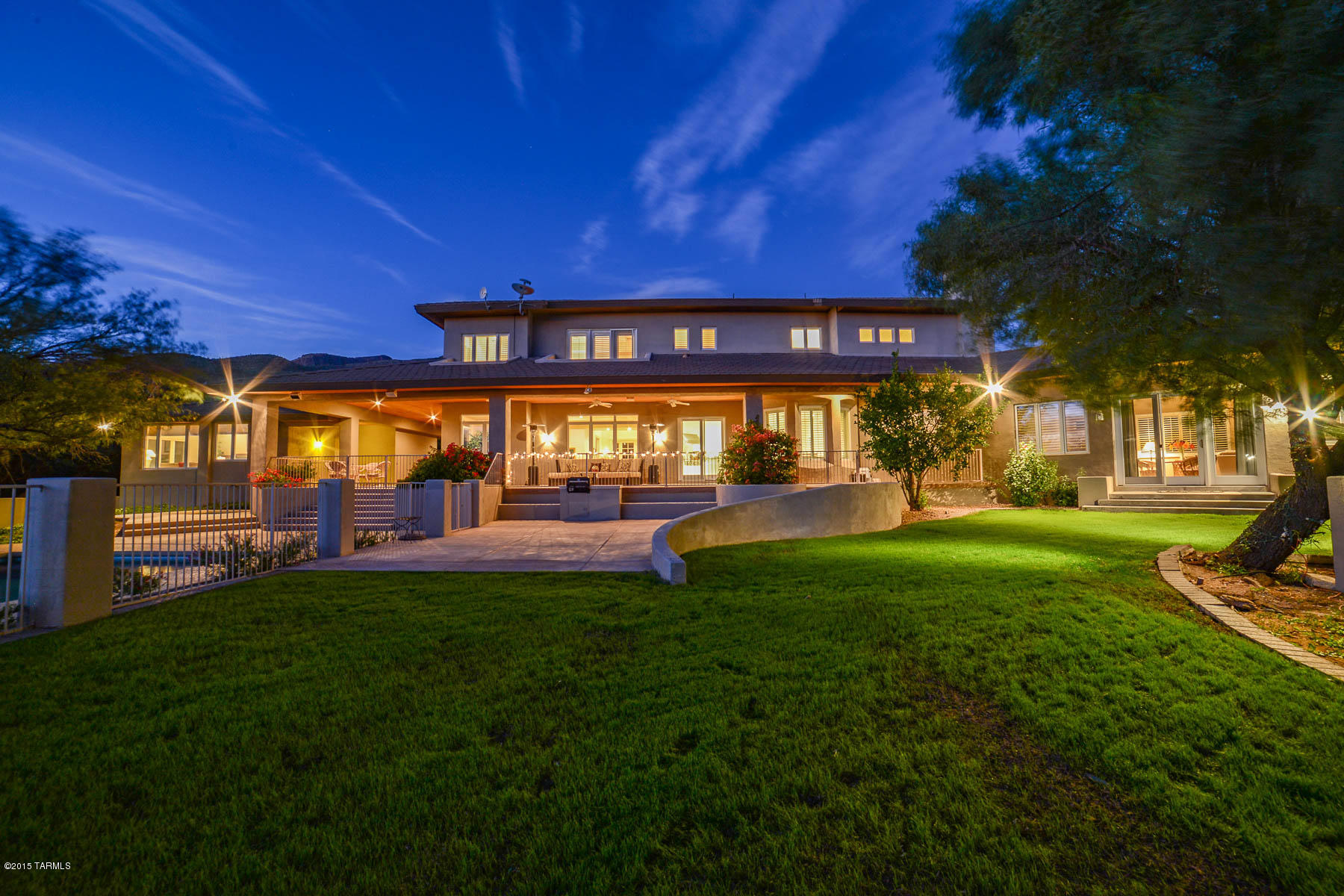 Outstanding Ron Robinette designed Mediterranean/Contemporary home on 3.38 private acres in prestigious gated Estrella Vista Est. Main house has 6130 sqft and cozy guest house has 772 sqft with kitchenette and 2 bedrooms, perfect for guests or in-laws! This immaculate Estate offers a grand entry with soaring ceilings and sweeping staircase to upstairs bedrooms. Countless upgrades include travertine tile & hardwood floors, gourmet kitchen with beautiful granite counters, designer appliances, formal dining room and open concept family room. Spacious media/rec room with room for anything you may desire. Private covered patio overlooks pool/spa and lush grass yard and vegetation serviced by private well. Enjoy the absolutely stunning Sunset Views and all this wonderful property has to offer!