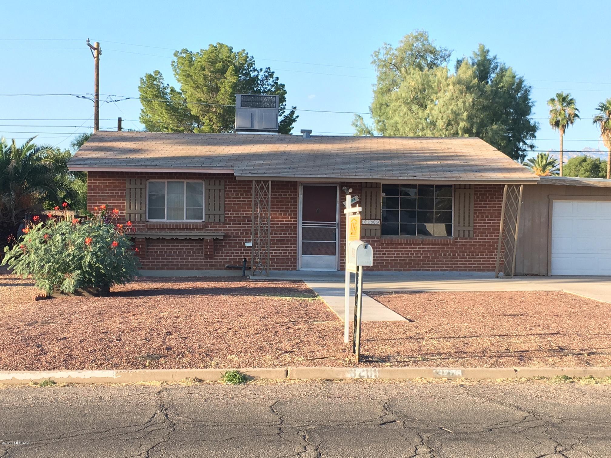 Centrally located Wire Cut Brick Home Within Walking Distance to Reid Park - Tucson's largest city park! Single garage and big concrete parking area in front! Deep front yard and wide street gives this neighborhood a spacious feel. Big back yard, too! This home has a super floor plan but, needs TLC and may not meet criteria for all loan programs. The assessor includes the addition in its estimate of SF but, the addition is unfinished and functions great for a workshop and storage. Corporate owned and no permit or maintenance history is available.