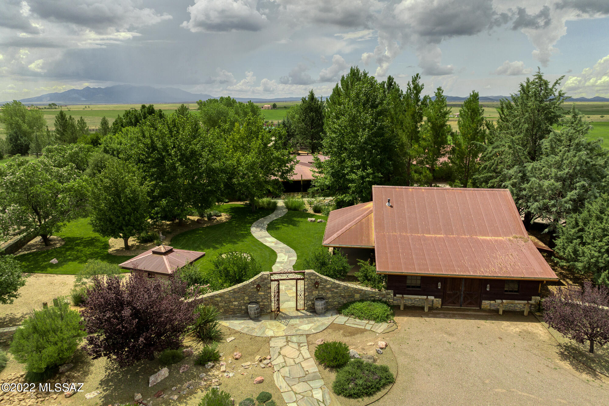 Over 50 acres fenced in horse property has a total of 12,000 square feet of buildings. No expenses were spared in creating this majestic ranch in the heart of of Southern Arizona Wine Country.  The Custom-Built has 3 bedrooms, 3 baths, 2 Master Suites, dining area, Living Room, Family Room, spacious laundry room  Huge L shaped Arizona room attached to home. Enjoy the surroundings on one of 5 separate porches. Property boast several detached buildings, Garages for 4 vehicles and 3 covered, circular driveway, Studio, Gym, 1,550 sq. foot Workshop with car lift. Equestrian area with 5 horse corrals, 4 horse stalls, 2 tack rooms and covered horse wash area.  This ranch property has endless possibilities for a winery, Bed and Breakfast or a wedding venue. YOU TUBE: 45 Iron Horse Ranch. Tax parcel ID #'s that are attached to the sale of this property.
109-24-007B, 109-22-022A, 109-22-003D.