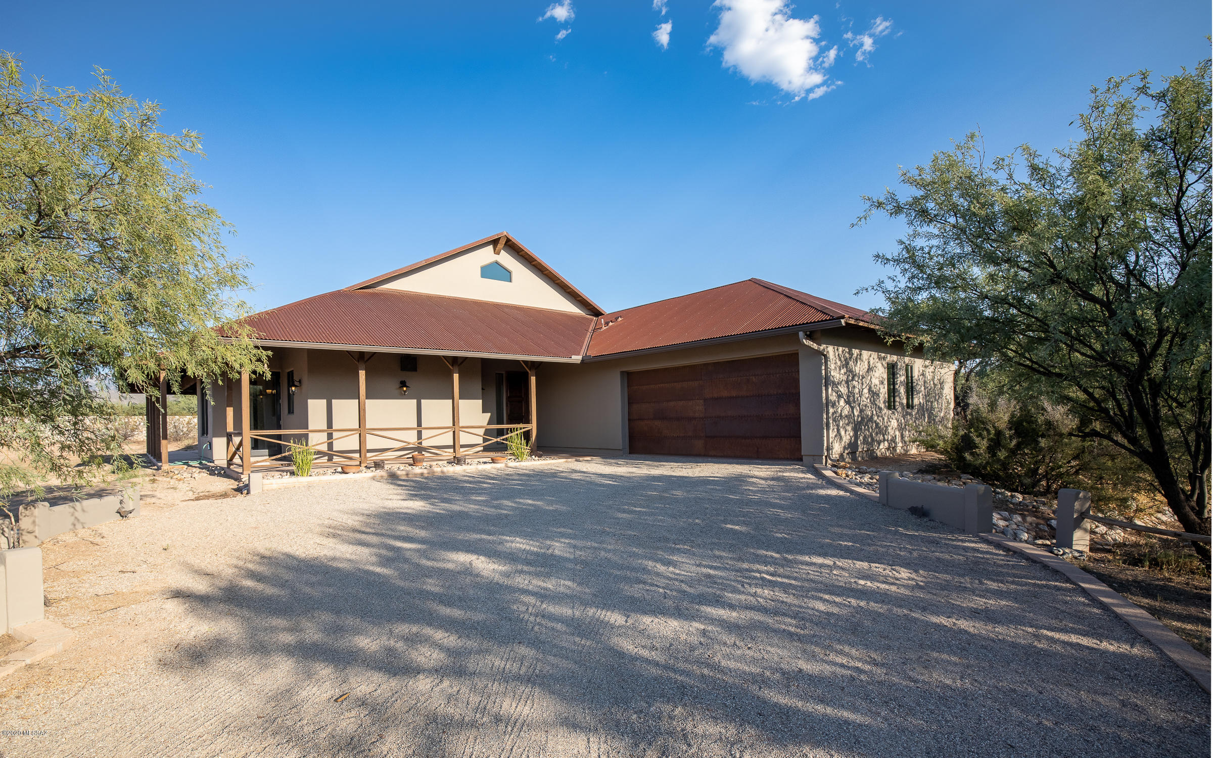 Beautifully built + designed, this home awaits the horse-loving desert-dweller with a passion for energy-efficiency + wildlife. 4/3 main house with 1/1 casita. FULL RV HOOKUP. Horse facilities. Enjoy an owned solar photovoltaic system, providing low electric bills year-round. Home is also on a whole-house carbon water filtration system, as well as boasting its own water softener unit. 48'' Viking professional series gas range for the esteemed chef. Scored concrete floors throughout, recently polished. Large owner's suite with enormous walk-in closet + large jetted tub. Instant hot water at all sinks. Casita has french door stainless steel fridge + kitchenette, separate bedroom + gas fireplace. Buyer to verify all facts + figures including those in MLS. See supplement for further details. FULL RV Hookup! 4/3 main house with 1/1 casita, both with wrap-around covered patios, plus horse tackroom, stables and arena. 2 car extended garage attached to casita includes gas hookup and washer/dryer included, plus 2-car extended garage attached to main house.

Main house and casita were both recently painted on the exterior and should last for many years to come. 

Stone countertops in owner's bathroom, outfitted with separate vanities, separate glass door shower and W.C. Beams throughout give it a modern yet rustic feel. 23 ft+ ceilings in the living room. 

Loft in main house has hardwood stairs leading to it, including hardwood floors once you get to the top. It offers a balcony with panoramic views of the mesquite tree valley and mountains. On its own heating/cooling, this loft also has its own private bathroom with a full shower and vanity.

Clawfoot tub in main hall guest bathroom is a gorgeous touch, with handheld sprayer and granite counters on the vanity. Walk-out bedroom with private patio was formerly used as a den/office space. Laundry room inside with washer/dryer included and utility sink. 

Island kitchen with concrete counters that have been polished and sealed within the last month. 

Roof is metal corrugated steel and has been the recipient of many compliments over the years.

Outdoor fire pit is framed by the stone rock wall and has potential to become quite the place for entertaining visitors and guests while enjoying the cooler desert nights.

Wired alarm system present at home, as well as pre-wired for satellite dish, smart thermostats and high-speed internet. 

Home is heated using energy-efficient gas heat pump, and a mini-split for the loft area. There is a recirculating pump on the hot water heater and instant hot at each of the sinks. 

There is a Well Agreement between the 3 houses who share the water, and it is divided based on usage. Their bill averaged $60/every 3 months including the electricity needed to operate the well. Catalina Well is the servicer. There is also a Road Maintenance Agreement that has no cost, but keeps the owners of the properties in communication regarding anything needed in terms of maintenance and upkeep.

Their average gas bill is around $47/month for both the casita and the main house. 

The HVAC system was replaced in 2016 with a hybrid heat pump instead of electric when it is below a certain temperature, it switches to gas in both the casita and the main house.

Being close to Forty Niner CC allows for the opportunity to connect the home to sewer at a less than average cost for a suburban ranch property, being that the lines are close and could be tied in. This is true also for the water connection, if the new homeowner would like to forego the well water in the future. 

Their trash/recycling bill is roughly $60 every 3 months, it was raised a little recently, but again being so close to a community like Forty Niner, they are able to take advantage of less than average rates on utility service costs due to proximity of existing routes. 

This is truly a remarkable opportunity for the sophisticated homeowner or one who is interested in entering the ranch lifestyle. Income opportunities abound between the casita income as well as the horse boarding and/or training capabilities.

Please consult with the listing agent on any detailed questions. Hoping for someone to take loving care of this ranch estate for many years to come.