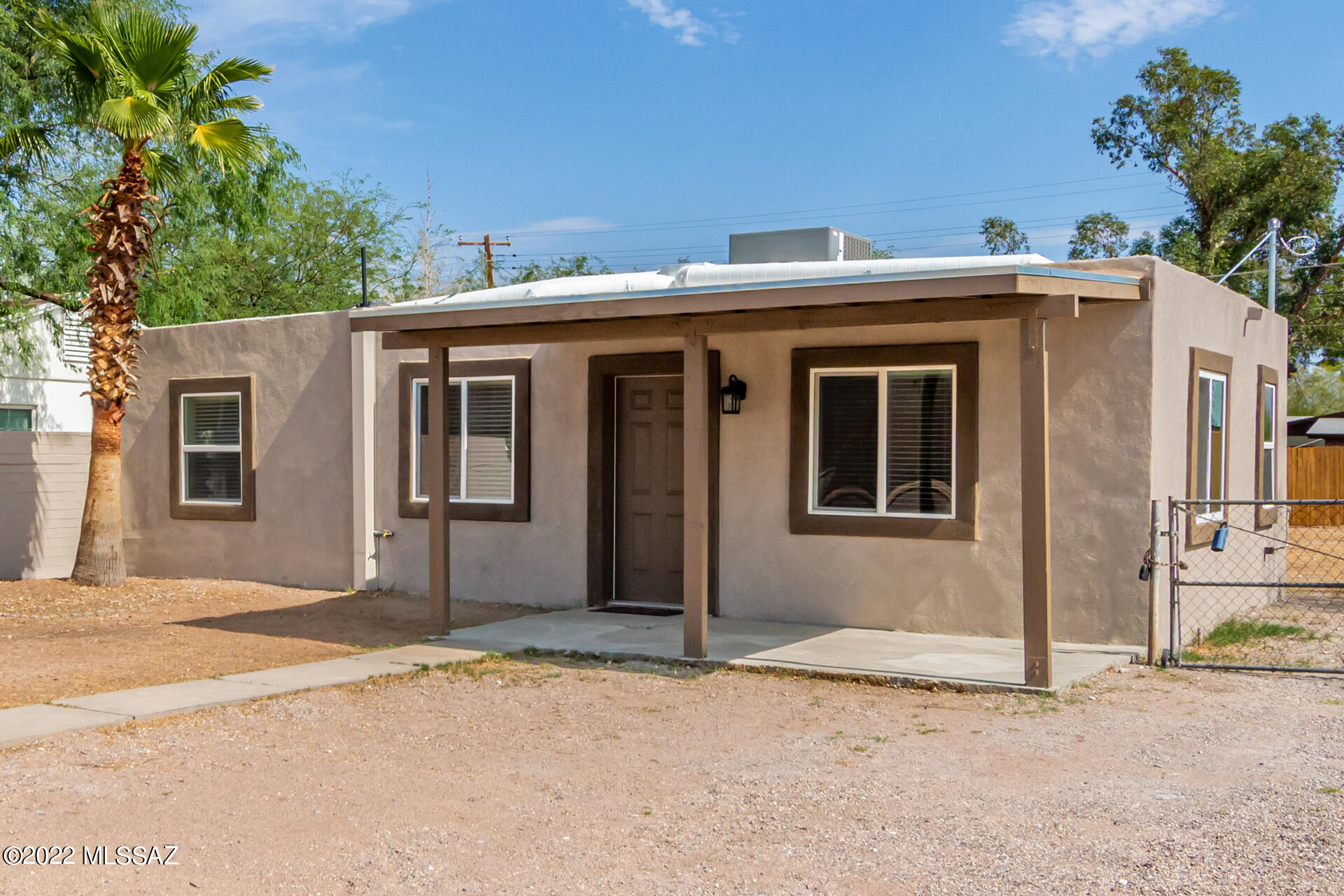 This midtown gem is conveniently located 4 miles from the University of Arizona. Beautifully updated 2 bedroom 1 bath, 800 sq ft home with an enormous back yard! With plenty of space for recreation vehicles. Walking distance from Randolph Park and Reid Park Zoo as well as many shops and restaurants. New laminate floor, new completely updated kitchen and bathroom, new AC. Everything has already been done for you! Move in ready! Come take a look before its gone.