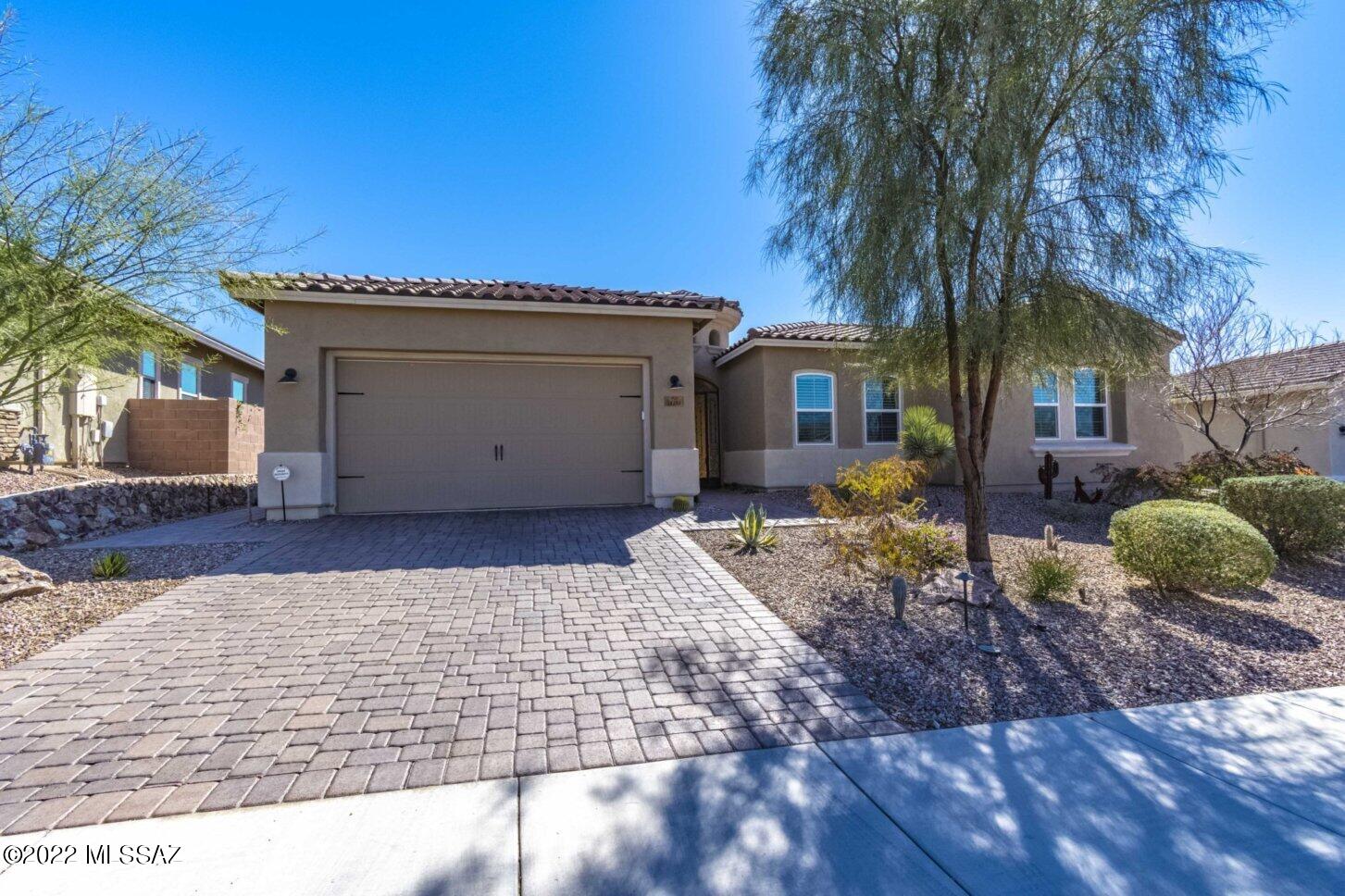 Gorgeous home in coveted gated community of Golden Barrel in Dove Mountain.  Gracious and elegant floor plan that offers over 3,000sf of living area, which includes gated entry courtyard with double sided gas fireplace, fountain and pavers.  Walk in the door to an extra large formal dining room attached to a huge living room with sliding glass doors that let you see the beauty of the backyard paradise unobstructed. Large gourmet kitchen with custom cabinetry, granite countertops, black stainless steel appliances, 5 burner gas cooktop, convection oven, microwave, spacious walk-in pantry plus, a large built-in dining area attached to the kitchen.  This 4 bedroom home even boasts of an ensuite secondary bedroom for guest's when they visit, office/den and we haven't even made it outside Gorgeous home in coveted gated community of Golden Barrel in Dove Mountain.  Gracious and elegant floor plan that offers over 3,000sf of living area, which includes gated entry courtyard with double sided gas fireplace, fountain and pavers.  Walk in the door to an extra large living room with sliding glass doors that let you see the beauty of the backyard paradise unobstructed. Large gourmet kitchen with custom cabinetry, granite countertops, black stainless steel appliances, 5 burner gas cooktop, convection oven, microwave, spacious walk-in pantry plus, a large built-in dining area attached to the kitchen.  This 4 bedroom home even boasts of a ensuite secondary bedroom for guest when they visit plus an office/den.  All this and we haven't even made it outside to the entertainment paradise.  Be greeted when you step out the door with a Salt Water pool w/ hot tub, built-in fireplace, built- in -barbecue and putting green all attached to a open space for privacy.