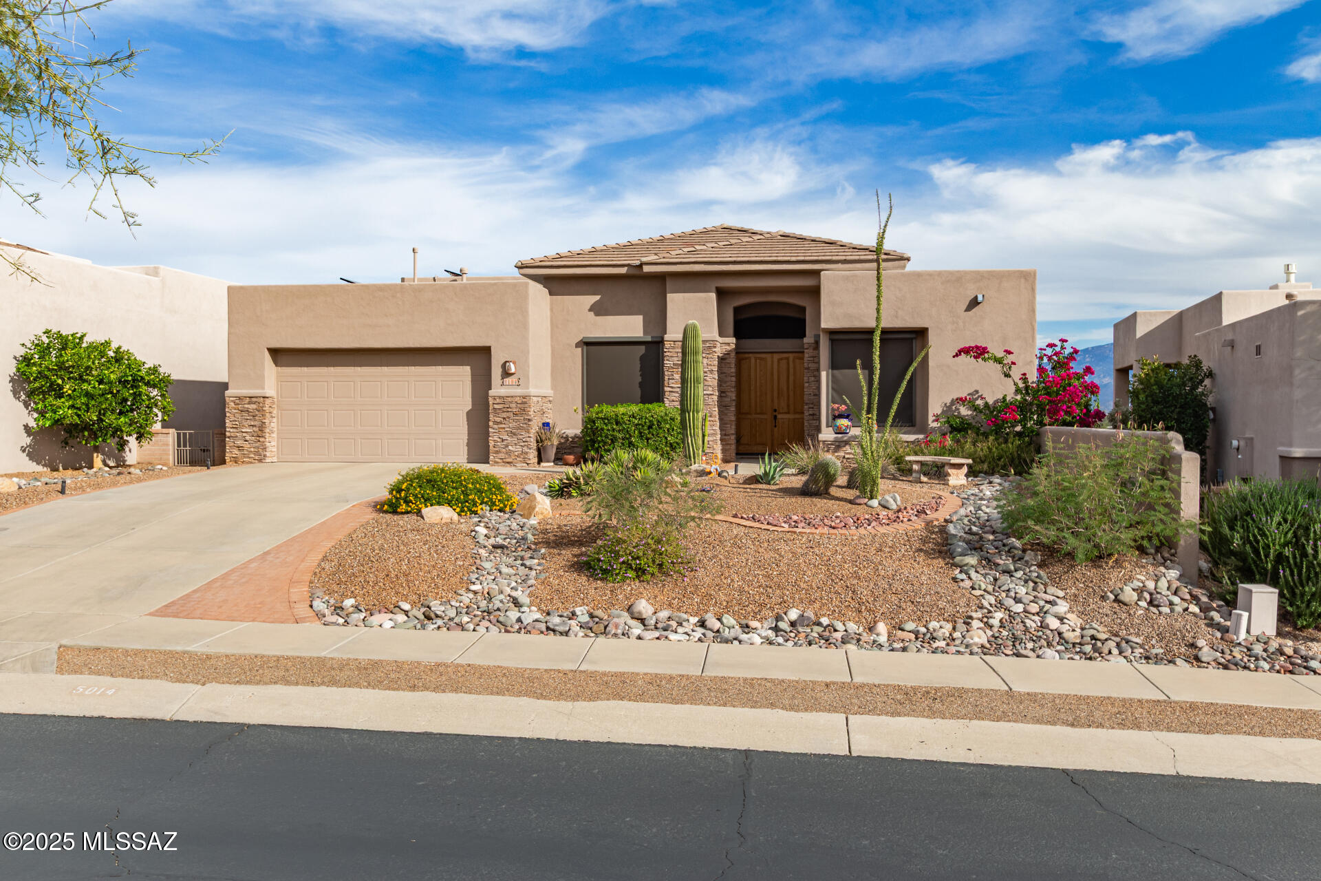 Million-Dollar Panoramic Views in Gated Fairfield Sabino Canyon! Your perfect MOVE-IN ready sanctuary awaits in the exclusive resort like community—minutes from the iconic Sabino Canyon Recreation Area and top-rated Catalina Foothills School District. This stunning 3-bedroom, 2-bathroom home with a 2-car garage boasts unobstructed 200° vistas of the Catalina and Rincon Mountains, framing every sunrise and moonrise like a masterpiece.  

Curb appeal that captivates with Stacked Stone accents and low-maintenance desert landscaping. Step inside to soaring high ceilings, abundant natural light cascading through expansive windows, and sleek tile flooring throughout the main living areas. The open-concept living room is an  entertainer's dream—centered around a cozy gas fireplace, with recessed lighting and seamless flow for modern foothill living.  

Energy-efficient upgrades for effortless luxury include  Owned solar system and converted electric heat pump water heater for ultra-low utility bills. East-facing rolling shutters and shades on the front for privacy and added energy efficiency. New roof membrane 2024. 

Unwind in the spacious primary suite  to those breathtaking backyard panoramas. The  spa-like bath features include a soaking tub and separate shower, The gourmet kitchen offers ample cabinets, a central island, and plenty of workspace-perfect for culinary adventures while gazing at the peaks.  

Community perks elevate your lifestyle with Gated security and a resort-style pool & spa with jaw-dropping mountain backdrop, sidewalks, and proximity to hiking trails, golf, shopping, dining and world renowned Canyon Ranch and Lowes Ventana resorts.  This is foothills living at its finest-quiet, convenient, and utterly captivating**.  Don't miss out on this gem and claim your slice of Tucson paradise! 

WiFi Apps to assist home - Nest Home (Thermostat & Doorbell), Shade Connector (Rolling Shutters), Econet (Hot water Heater), My Solar Edge ( PV System / monitor production). 

Technology - Alarm System (circa 2000 existing alarm system), pre wired Sat dish,  pre wired tele lines, Smart Thermostat, Pre wired Ethernet.