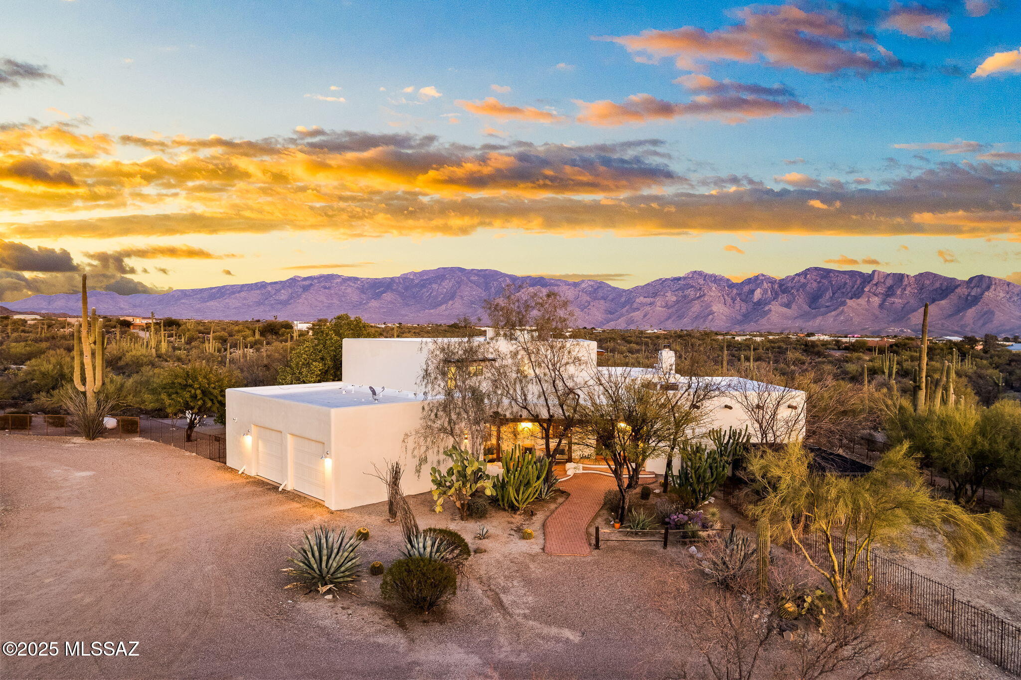 Nestled in the ultra-private, highly sought-after La Cholla Airpark community, this stunning 7.38-acre property offers some of the best horse facilities, views, and privacy you will find. This timeless southwest-style property includes a 3,551 sq ft main home with 4 bedrooms and 3.5 bathrooms, plus a 1,500 sq ft detached guest house, as well as elite horse facilities crafted for the most discerning equestrian. Breathtaking views of the Catalina and Tortolita mountains frame this pristine retreat, complete with access to a private 4,500' runway—perfect for your plane or small jet.
 
The well-appointed main house boasts a first-floor primary suite, solid wood cabinets and doors, Saltillo tile flooring, tiled countertops, and a striking wood ceiling with exposed beams. Enjoy an upstairs sitting area, large laundry room, covered patio with brick pavers, custom pool and spa, and a fenced area with artificial turf. Mature desert landscaping and custom fencing enhance the property's charm.

Ideal for guests, the private guest house features a fully equipped kitchen, open floor plan, wood ceilings, concrete floors, a generous bedroom, and a full bathroom with tub. A large, climate-controlled workout/game room adds versatility and comfort.

Designed for horse enthusiasts, the premier equestrian facilities include a 150' x 100' covered and lighted arena with imported sand and sprinklers, five sheltered stalls with extended coverage, mounted feeders, a two-stall wash bay with hot/cold water, an enclosed tack and feed room, and a storage room with bathroom. A custom round pen with imported sand completes this exceptional offering.

Directly connected to equestrian trails, this rare, all-season property is perfect for personal enjoyment, boarding, or hosting special events.  The possibilities are endless, all in a secluded yet accessible location only minutes from shopping and dining. Don't miss this unique blend of luxury, privacy, and functionality.