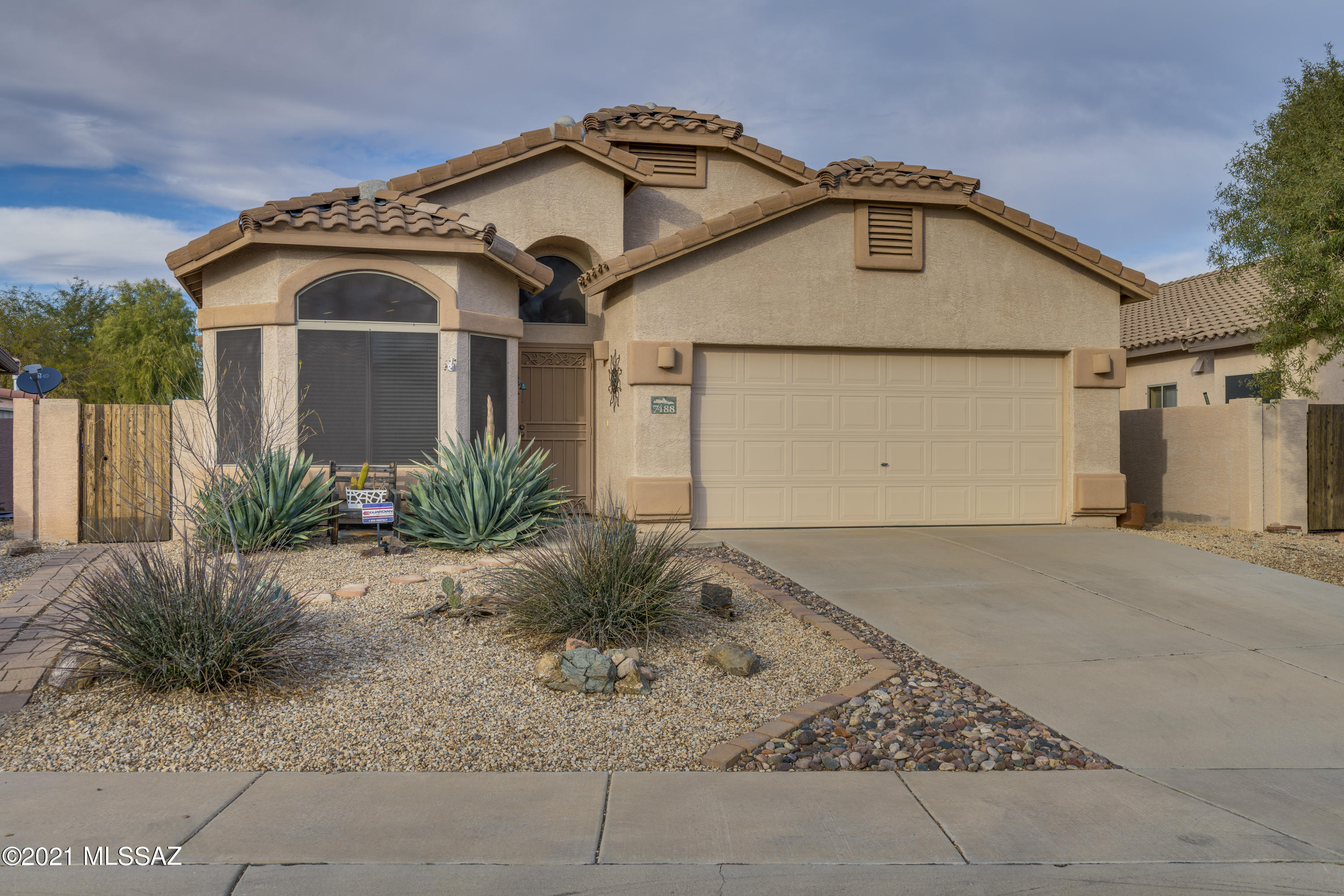 Nestled Marana Oasis! Gorgeous 3 bed, 2 bath home with solar-heated pool, new thermostat, pool filter, pump and pool cleaner. HVAC system is 2 years old. New irrigation system in front and back of home. Sellers expanded their view of backyard by installing a 12 ft oversized sliding glass door to enhance lighting in the home and view of backyard and extended patio. Now, it brings the outside in and is great for entertaining by your fire pit. Some furniture is available on separate bill of sale. (Please see Docs for description and price) buyers to assume whole home solar loan. Walking distance to the Bike Loop, library park, restaurants and shopping.