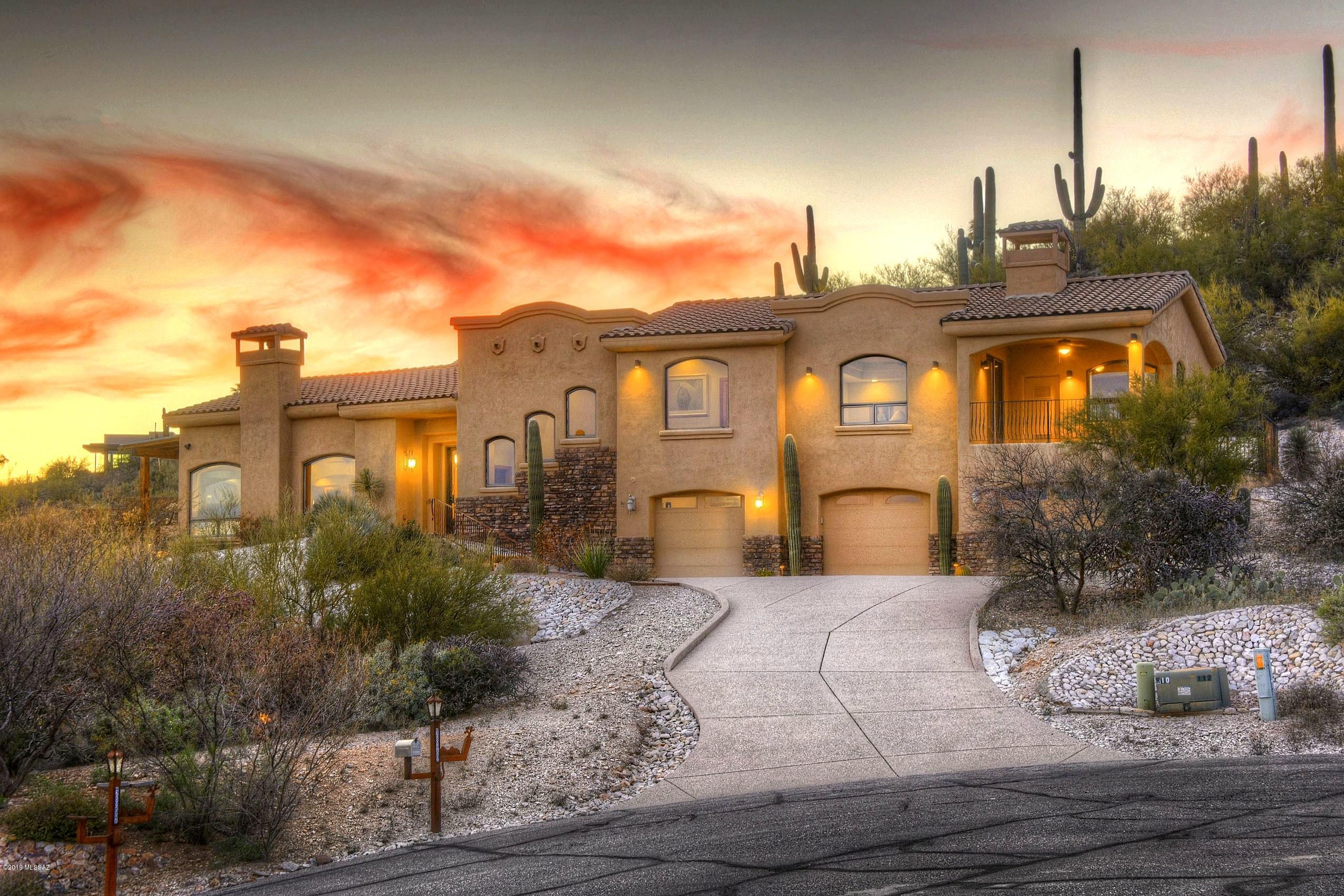 Take a 3D Virtual Tour thru this Absolutely spectacular city & mountain views from this gorgeous, extremely well built & lightly lived in custom home. Lovely entry welcomes you into the greatroom w/hi beamed ceilings, cozy FP & huge wood framed windows capturing the glorious views! Gourmet kitchen offers a gas range, SS appl, rich cabinetry & gorgeous granite. Dining area features a coved ceiling & more city views. Fabulous private backyard w/sparkling pool, lg covered patio & views of the saguaro-studded hillside. This home also has 2 masters, one w/delightful viewing deck, plus lg walk-in closets w/amazing built-ins. All bdrms have ensuite baths plus a charming powder. Ceramic & wood floors thru-out, enormous 3-car gar w/epoxy flrs & super energy efficient ICF Reward block construction